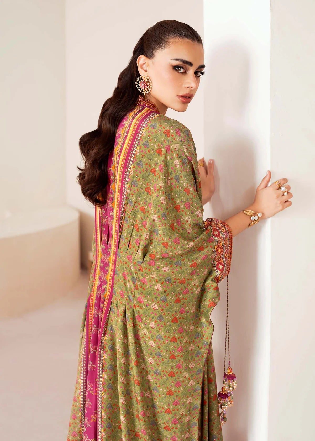 Model wearing green and magenta Deja from Kanwal Malik Rosalia Silk Eid Collection '25, Pakistani luxury pret available online in UK.