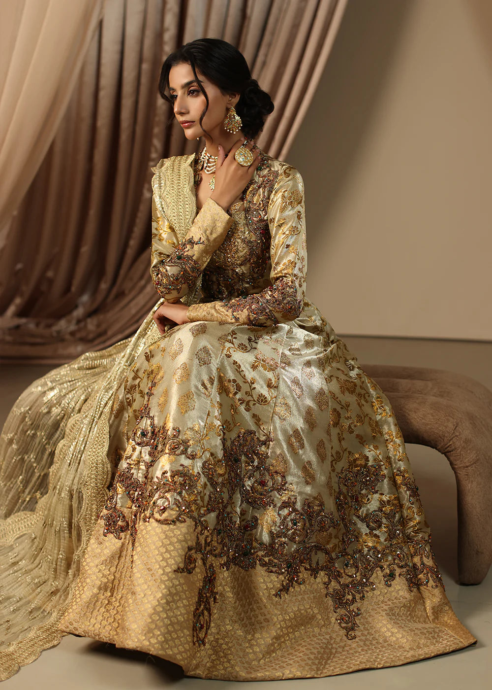 Model wearing gold heavily embroidered dress from Musferah Saad Eternal Grace, Pakistani luxury pret available online in UK.