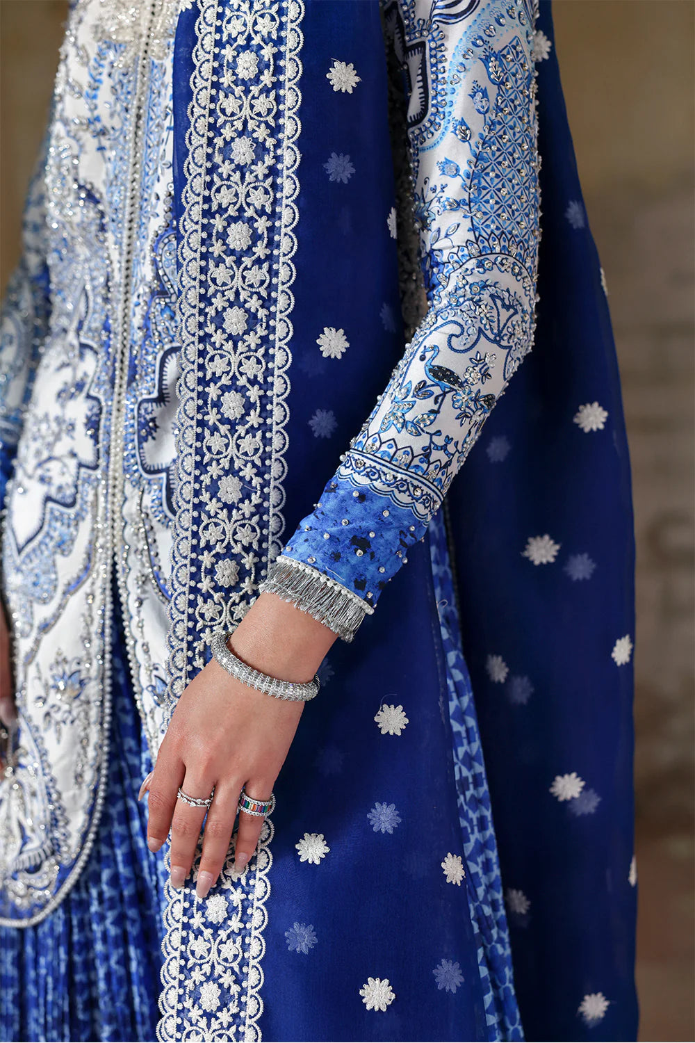 Model wearing Evadia by Soraya in ivory and royal blue printed outfit – Pakistani luxury pret available online in UK for festive wear.