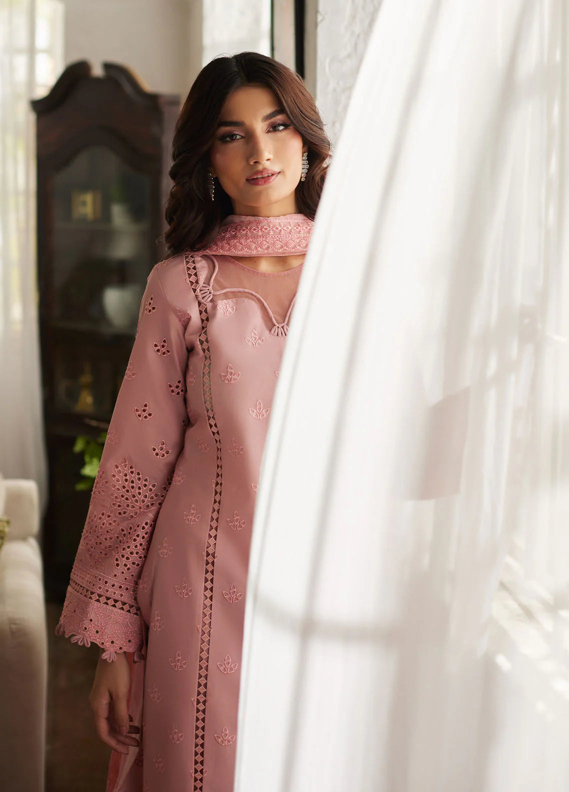 Model wearing blush pink Zerin from Gulaal Lumiere Chikankaari Lawn, Pakistani luxury pret and Pakistani clothes online in UK.