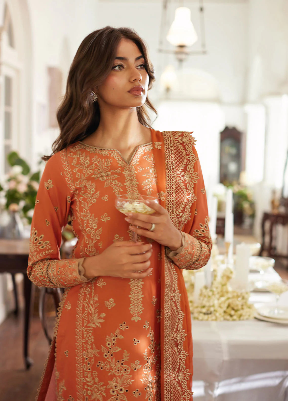 Model wearing rust orange Solara from Gulaal Lumiere Chikankaari Lawn, Pakistani luxury pret and Pakistani clothes online in UK.