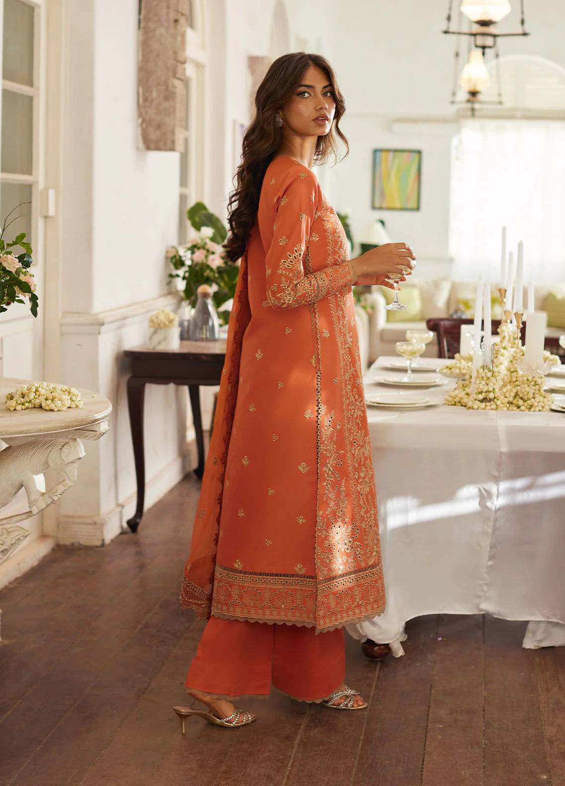 Model wearing rust orange Solara from Gulaal Lumiere Chikankaari Lawn, Pakistani luxury pret and Pakistani clothes online in UK.