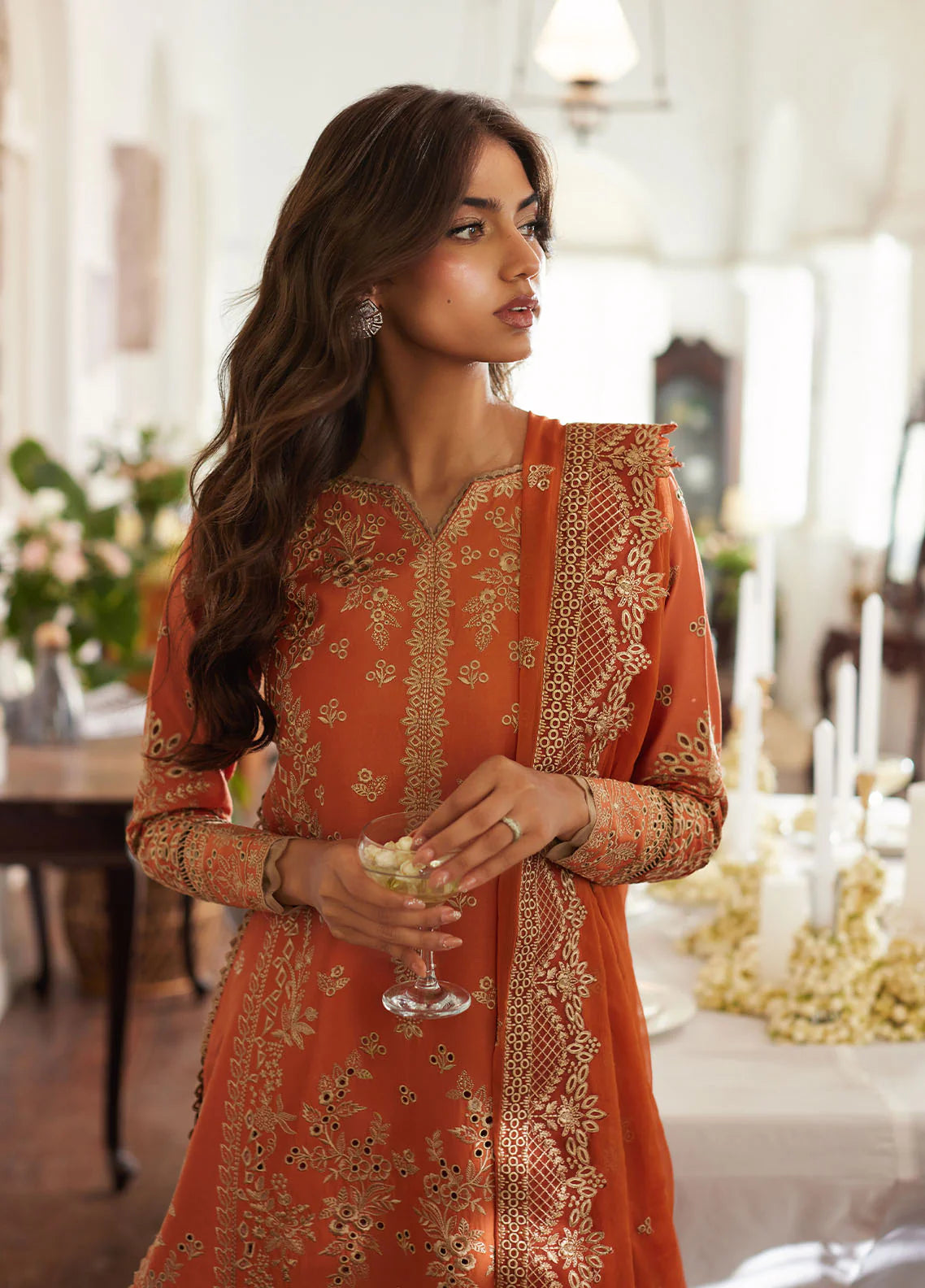 Model wearing rust orange Solara from Gulaal Lumiere Chikankaari Lawn, Pakistani luxury pret and Pakistani clothes online in UK.