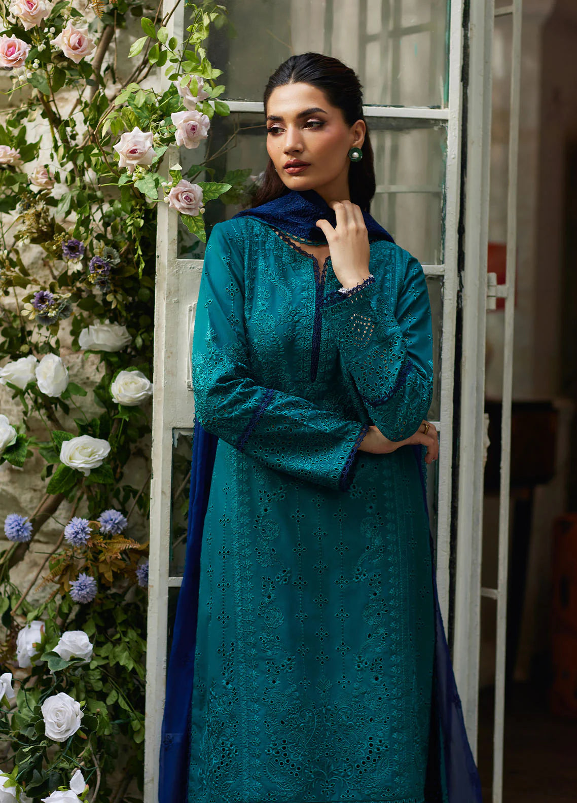 Model wearing teal blue Azura from Gulaal Lumiere Chikankaari Lawn, Pakistani luxury pret and Pakistani clothes online in UK.