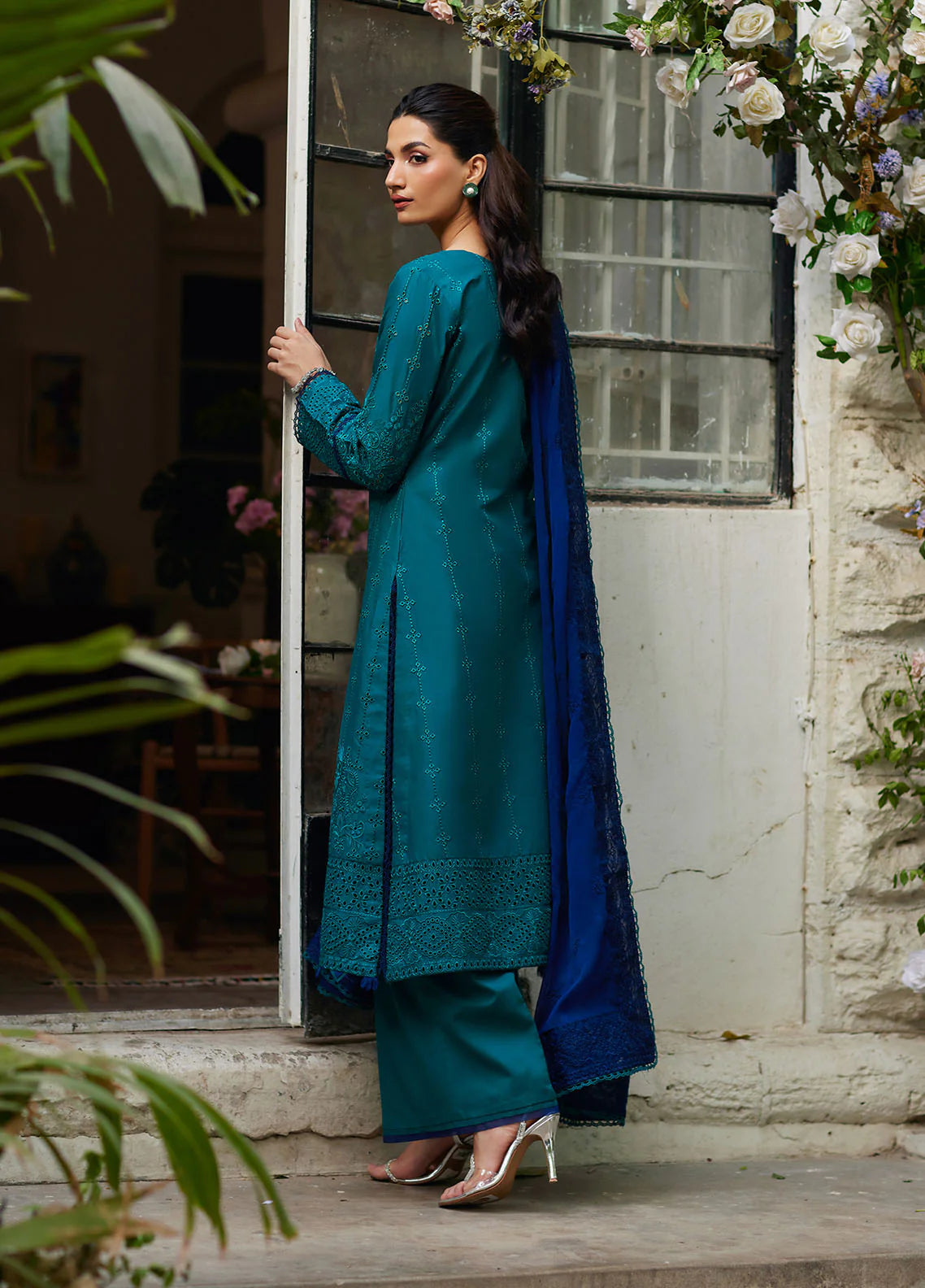 Model wearing teal blue Azura from Gulaal Lumiere Chikankaari Lawn, Pakistani luxury pret and Pakistani clothes online in UK.