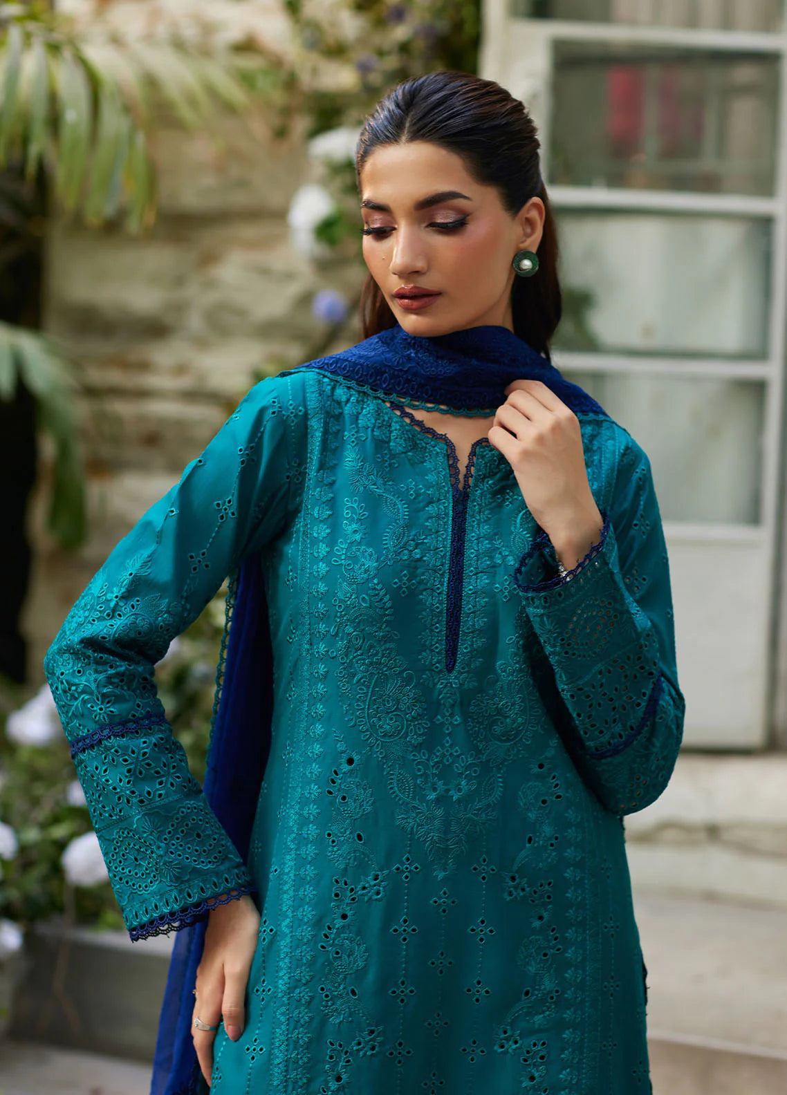 Model wearing teal blue Azura from Gulaal Lumiere Chikankaari Lawn, Pakistani luxury pret and Pakistani clothes online in UK.