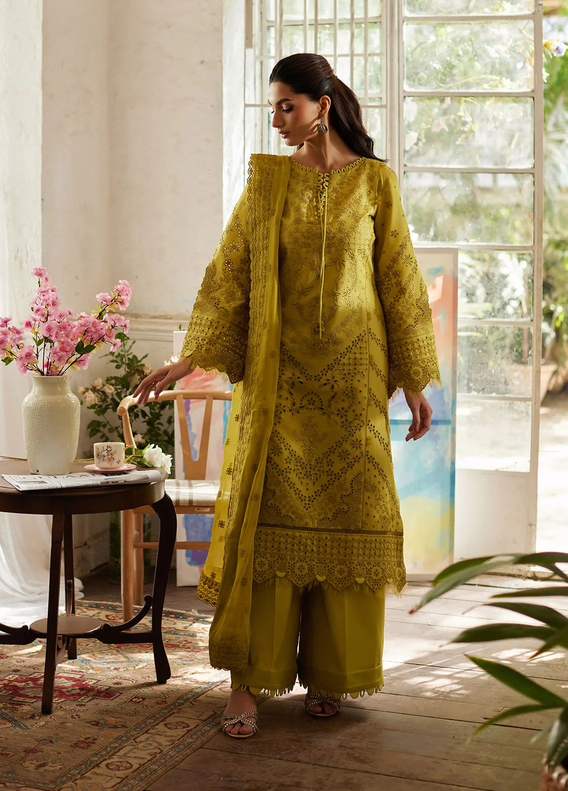 Model wearing mustard yellow Aurelia from Gulaal Lumiere Chikankaari Lawn, Pakistani luxury pret and Pakistani clothes online in UK.