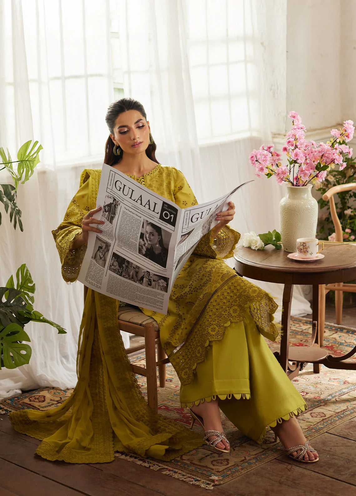 Model wearing mustard yellow Aurelia from Gulaal Lumiere Chikankaari Lawn, Pakistani luxury pret and Pakistani clothes online in UK.