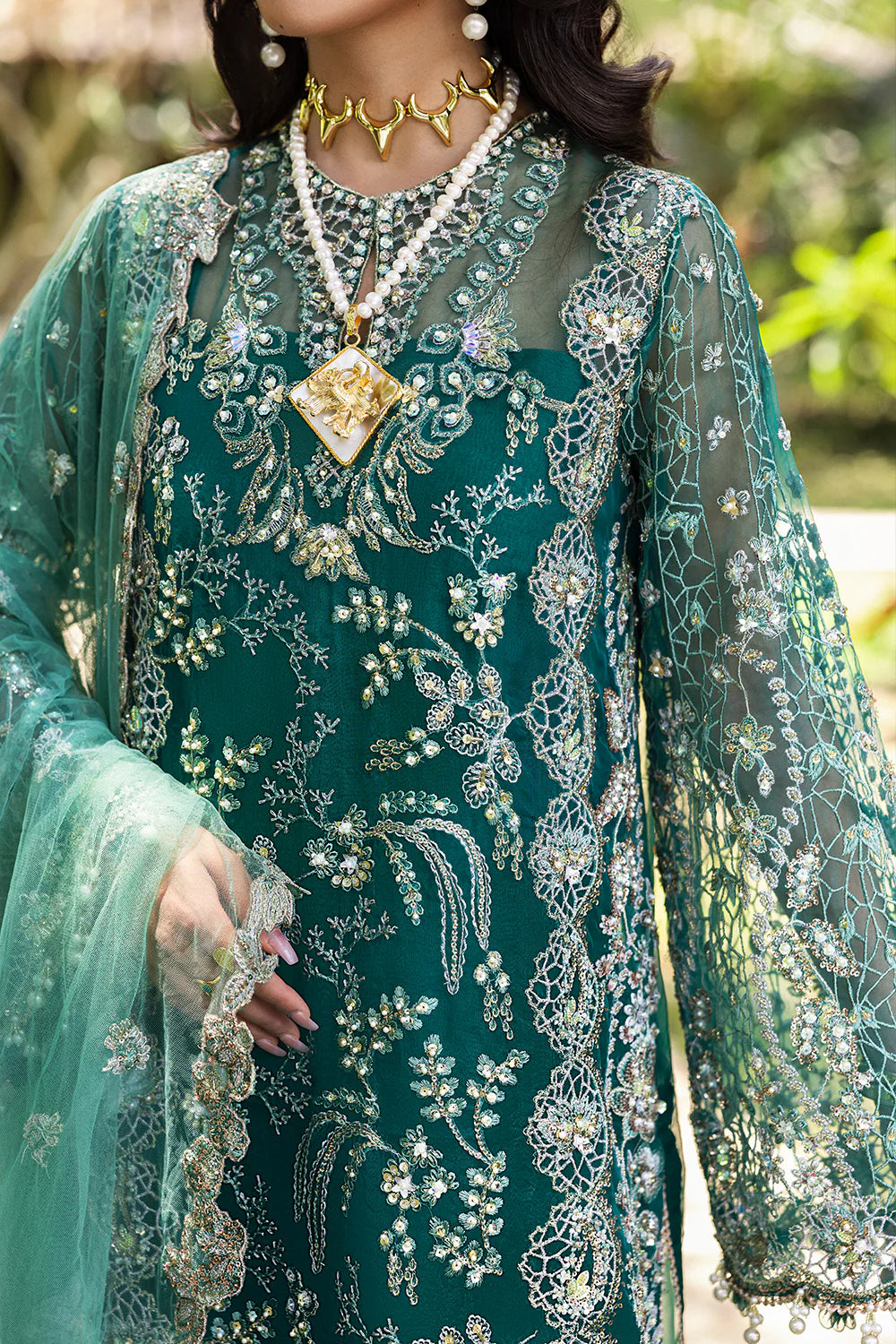 Model wearing Saira Rizwan KIANA-SRF25-04 in emerald green with silver embellishments – Pakistani luxury pret, shop online in UK.