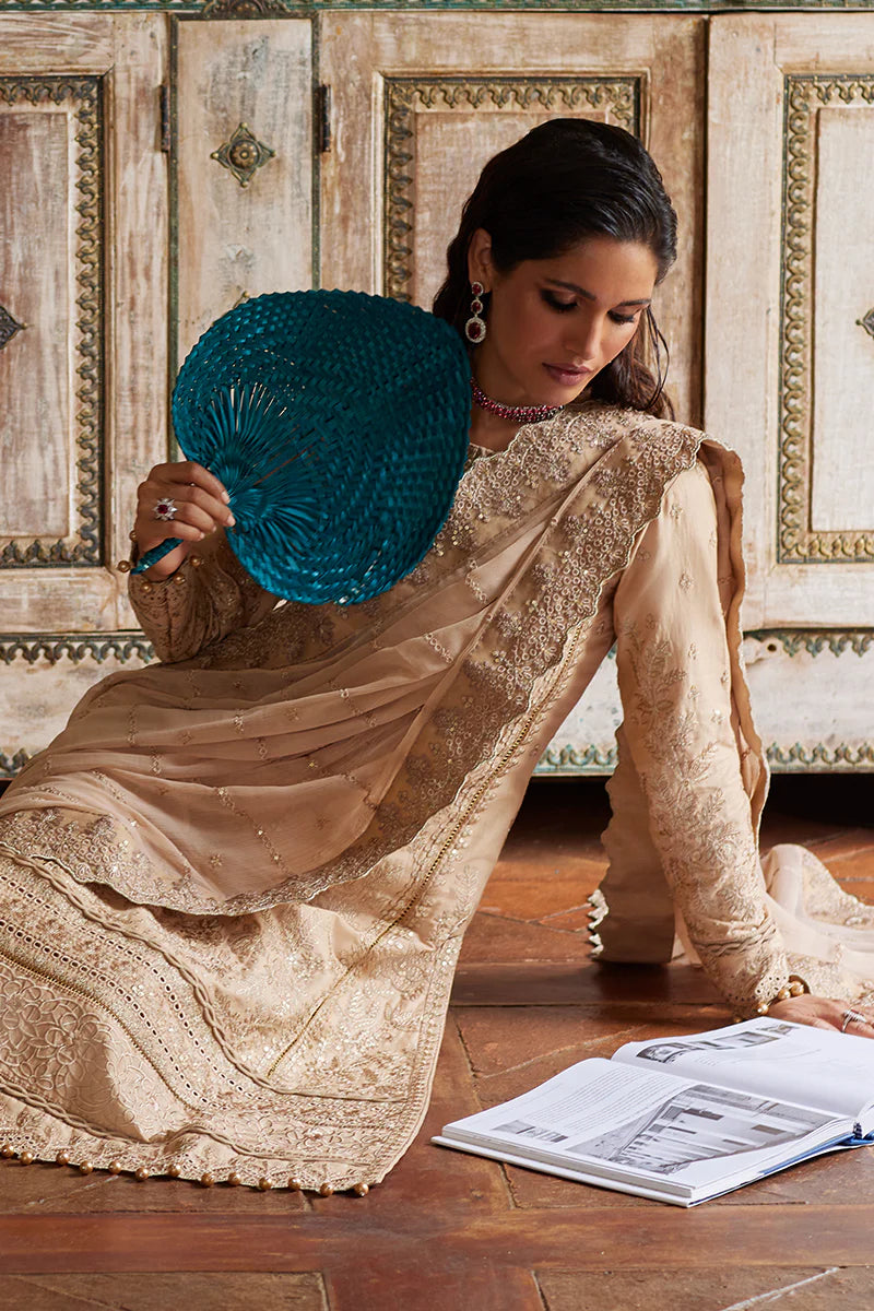 Model wearing Gulaal DAPHNE gold luxury lawn dress with intricate embroidery. Shop Pakistani luxury pret online in the UK for an elegant look.