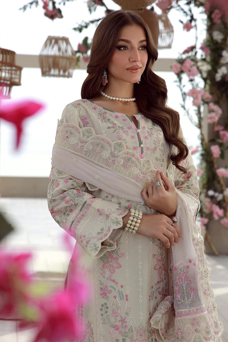 Model wearing off-white and pink embroidered Gulaal Kaia suit, perfect for Eid celebrations and Pakistani luxury pret online in UK.