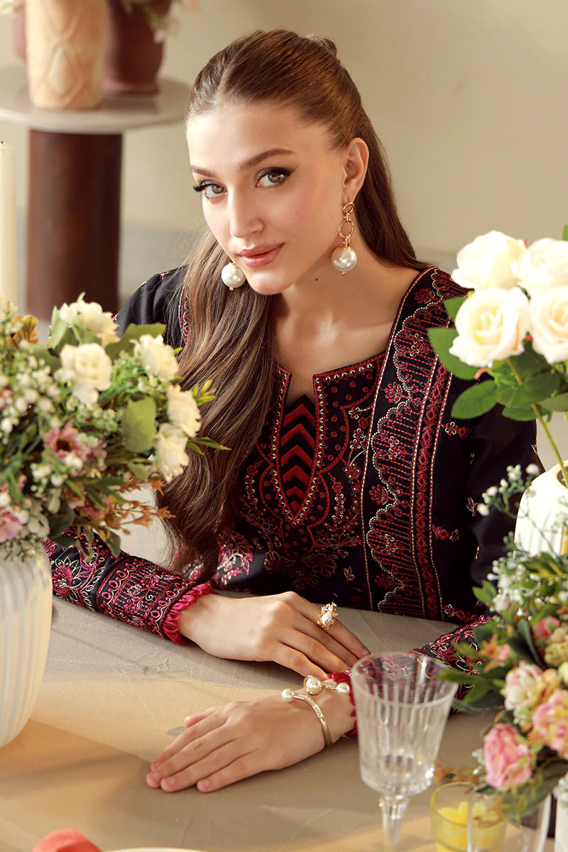 Model wearing black and maroon embroidered Gulaal Faina outfit, perfect for Eid wear and Pakistani luxury pret available online in the UK.