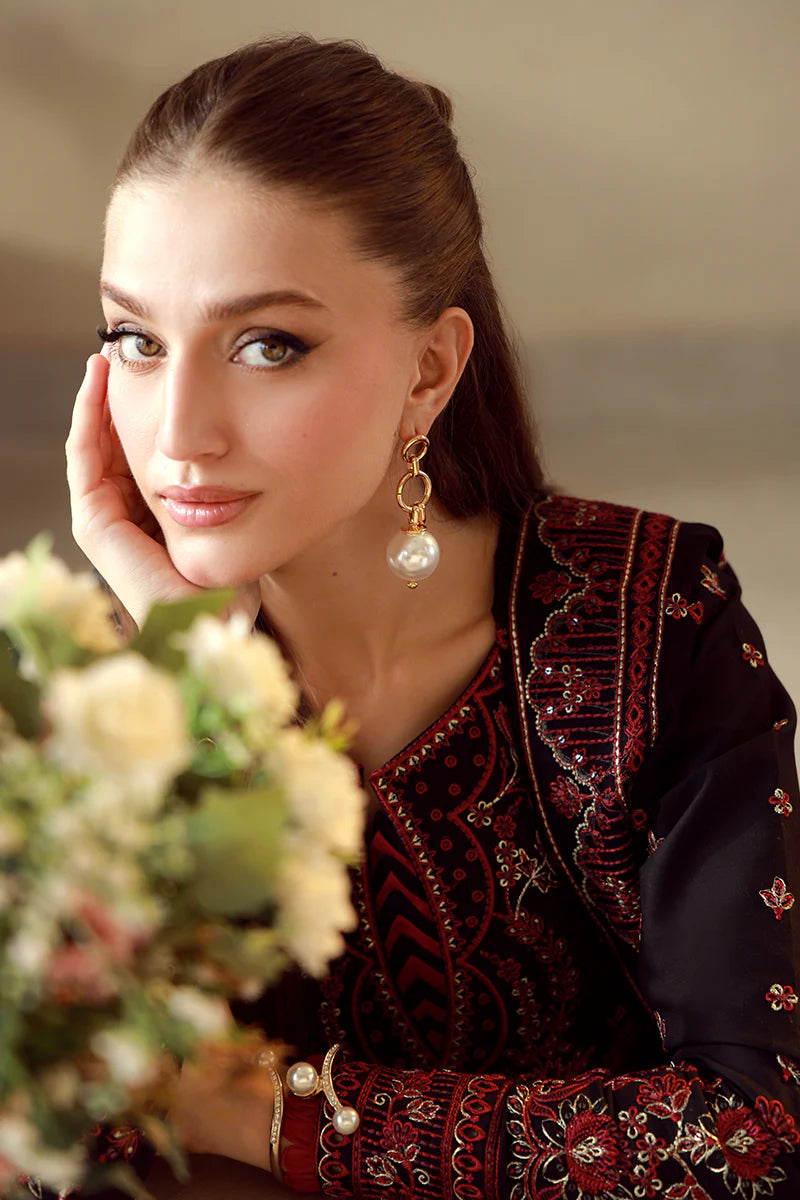 Model wearing black and maroon embroidered Gulaal Faina outfit, perfect for Eid wear and Pakistani luxury pret available online in the UK.