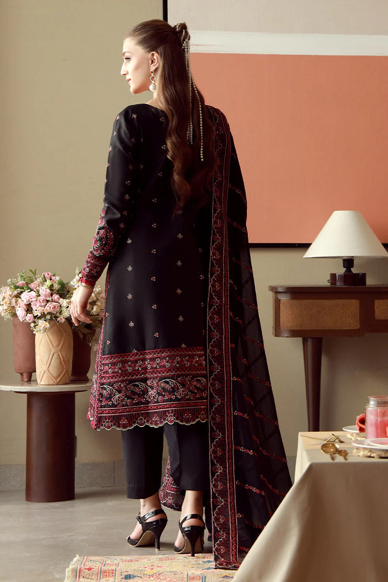 Model wearing black and maroon embroidered Gulaal Faina outfit, perfect for Eid wear and Pakistani luxury pret available online in the UK.