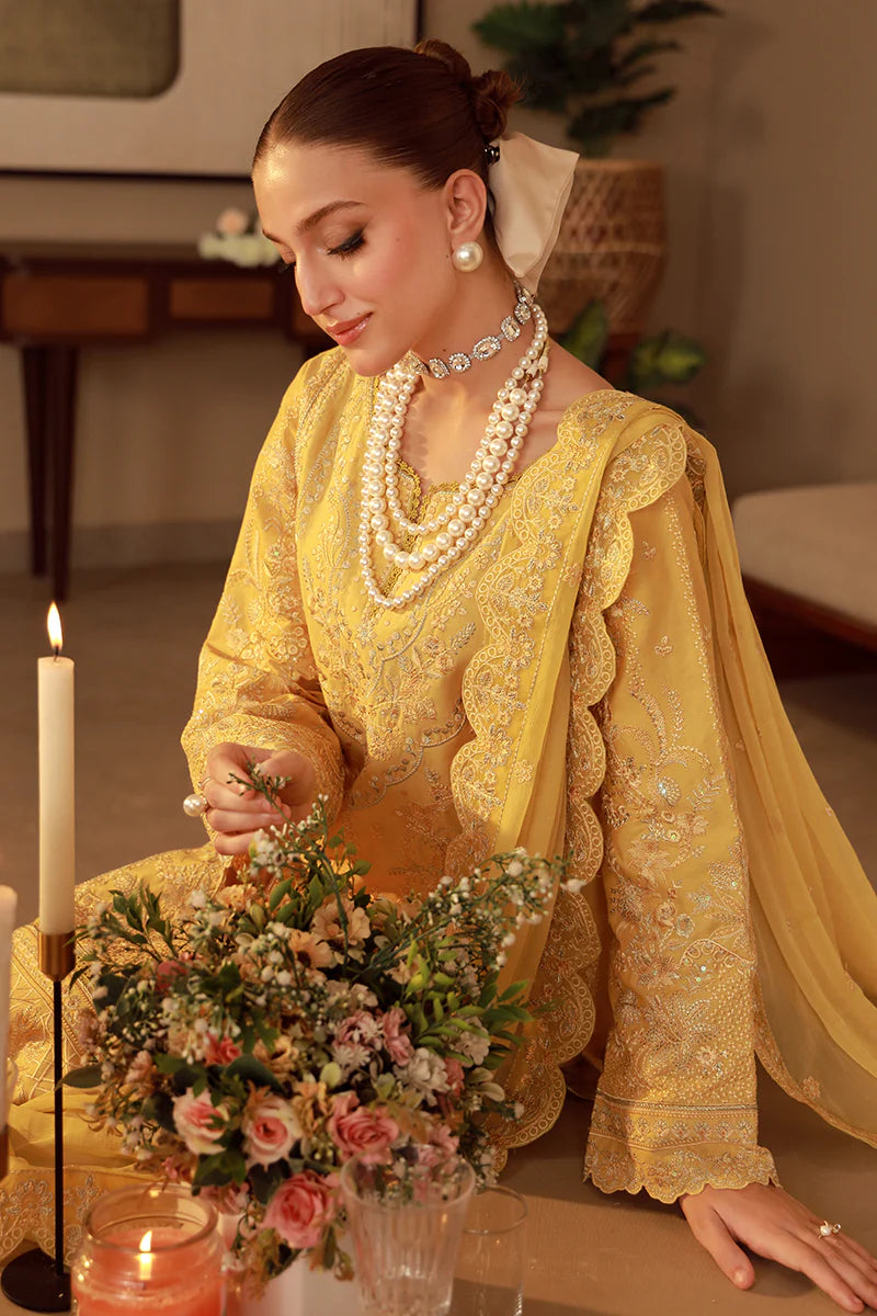 Model wearing mustard yellow embroidered Gulaal Ura outfit, ideal for Eid wear and Pakistani luxury pret, available online in the UK.
