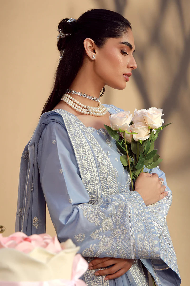 Model wearing cashmere blue embroidered Nehal outfit from Gulaal Festive Pret, perfect for Pakistani luxury pret and Eid wear in the UK.