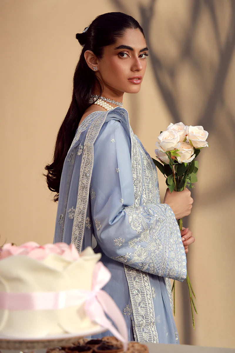 Model wearing cashmere blue embroidered Nehal outfit from Gulaal Festive Pret, perfect for Pakistani luxury pret and Eid wear in the UK.
