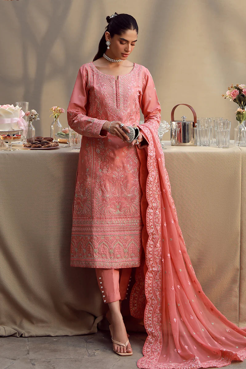 Model wearing coral pink embroidered Ira outfit from Gulaal Festive Pret, perfect for Pakistani luxury pret and Eid fashion in the UK.