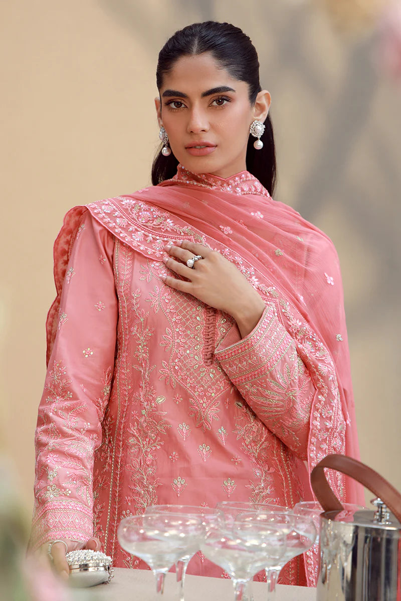 Model wearing coral pink embroidered Ira outfit from Gulaal Festive Pret, perfect for Pakistani luxury pret and Eid fashion in the UK.