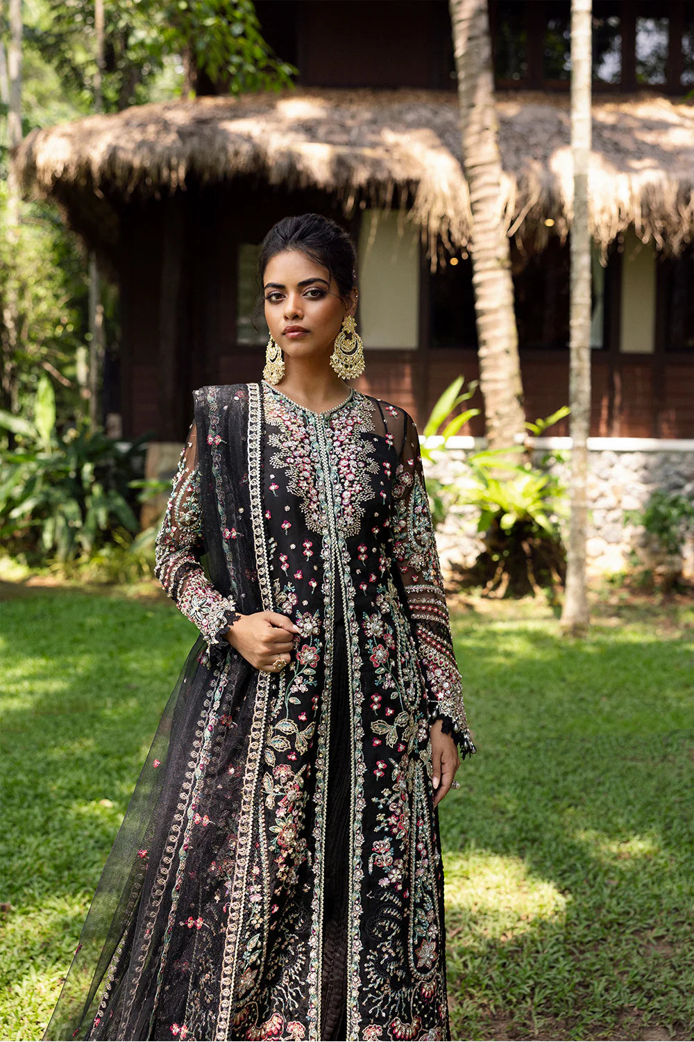 Model wearing Saira Rizwan AVINA-SRF25-02 in black with pastel floral embroidery – Pakistani luxury pret, shop online in UK.