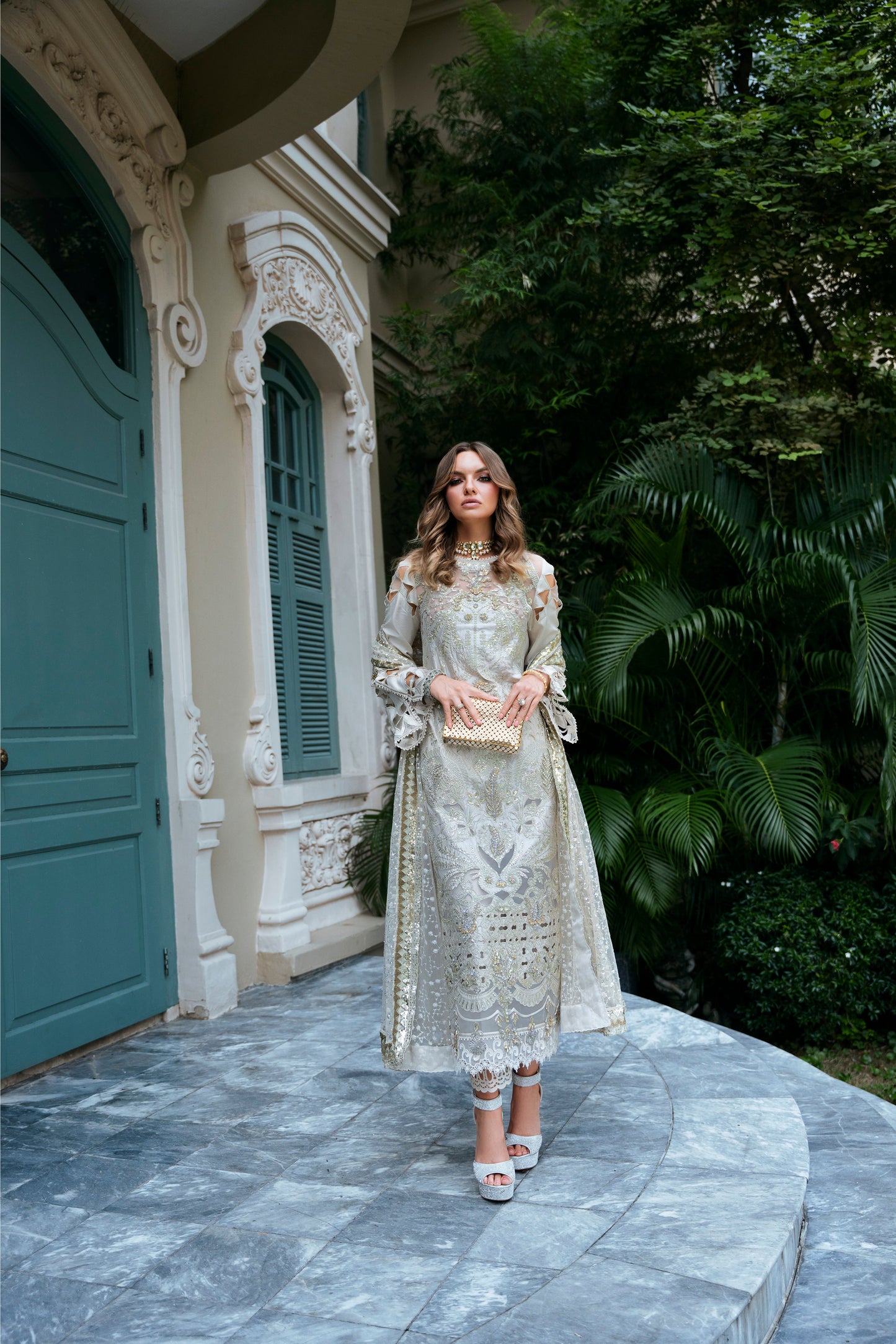 Model wearing Helena dress from Mysie by Tahira in a soft gold color, perfect for Pakistani luxury pret and online shopping in the UK.