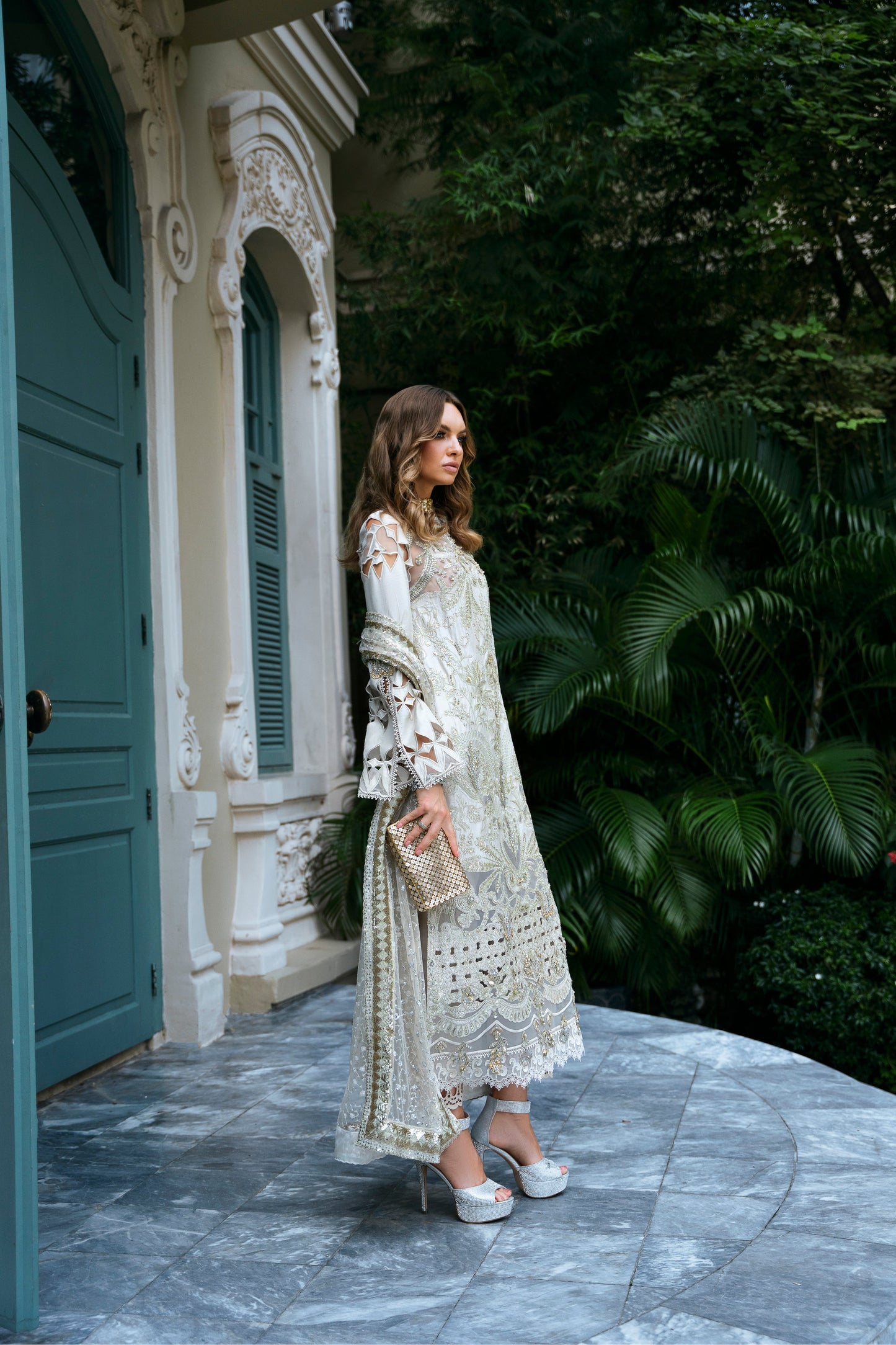Model wearing Helena dress from Mysie by Tahira in a soft gold color, perfect for Pakistani luxury pret and online shopping in the UK.