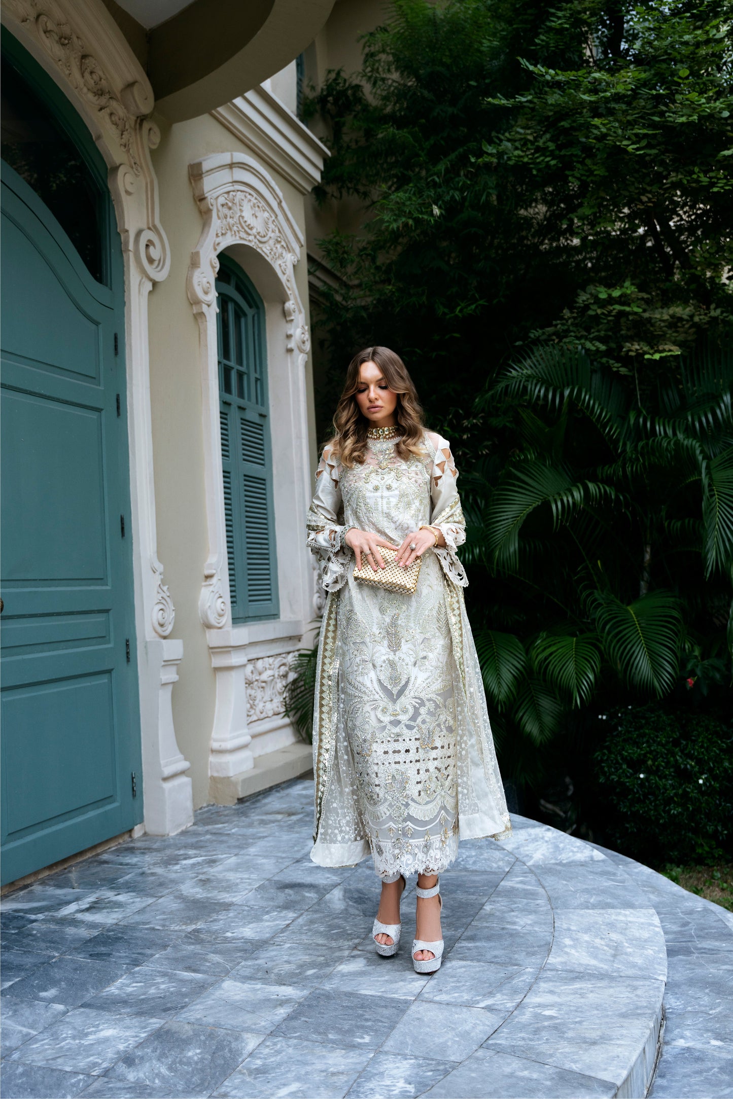 Model wearing Helena dress from Mysie by Tahira in a soft gold color, perfect for Pakistani luxury pret and online shopping in the UK.