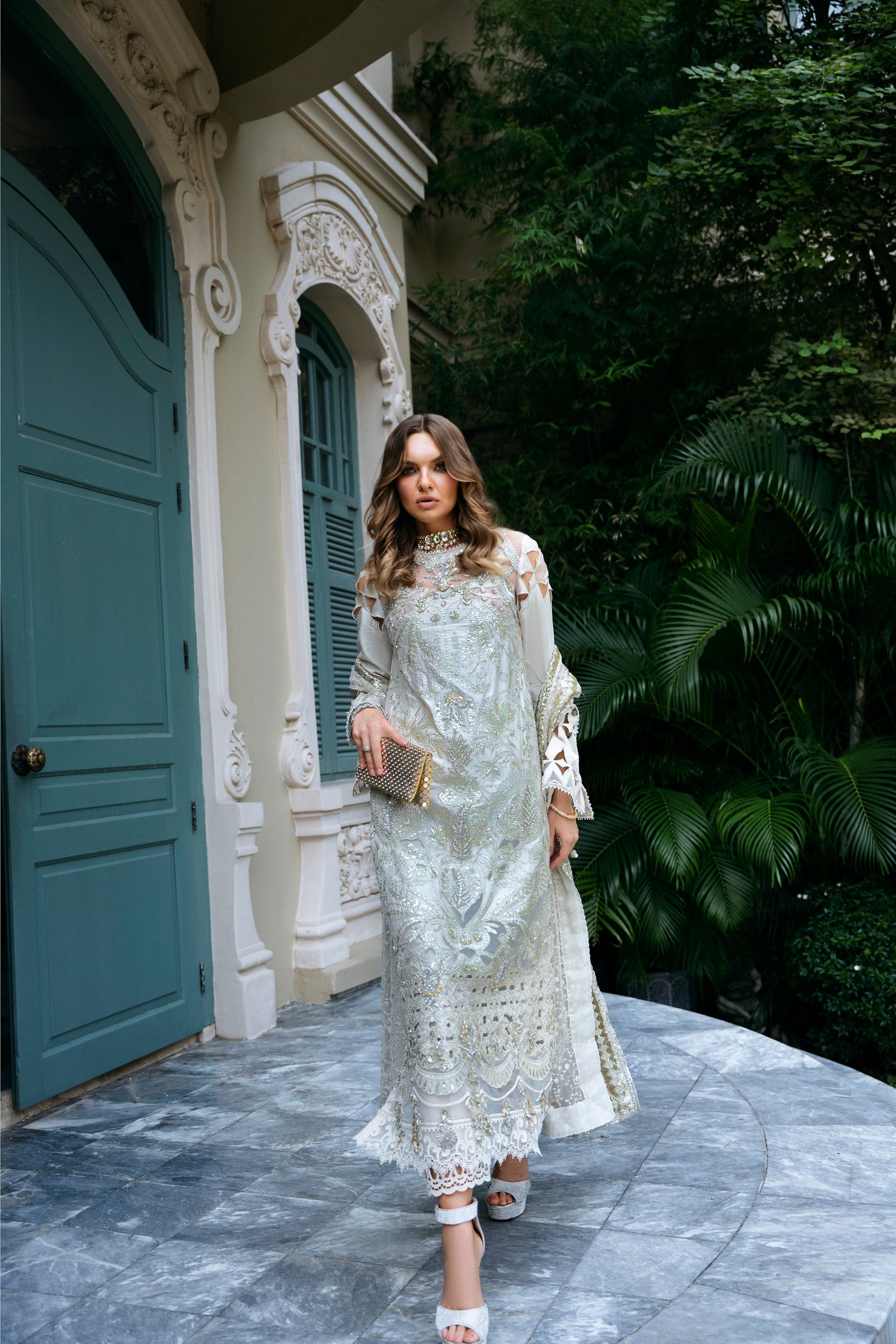 Model wearing Helena dress from Mysie by Tahira in a soft gold color, perfect for Pakistani luxury pret and online shopping in the UK.