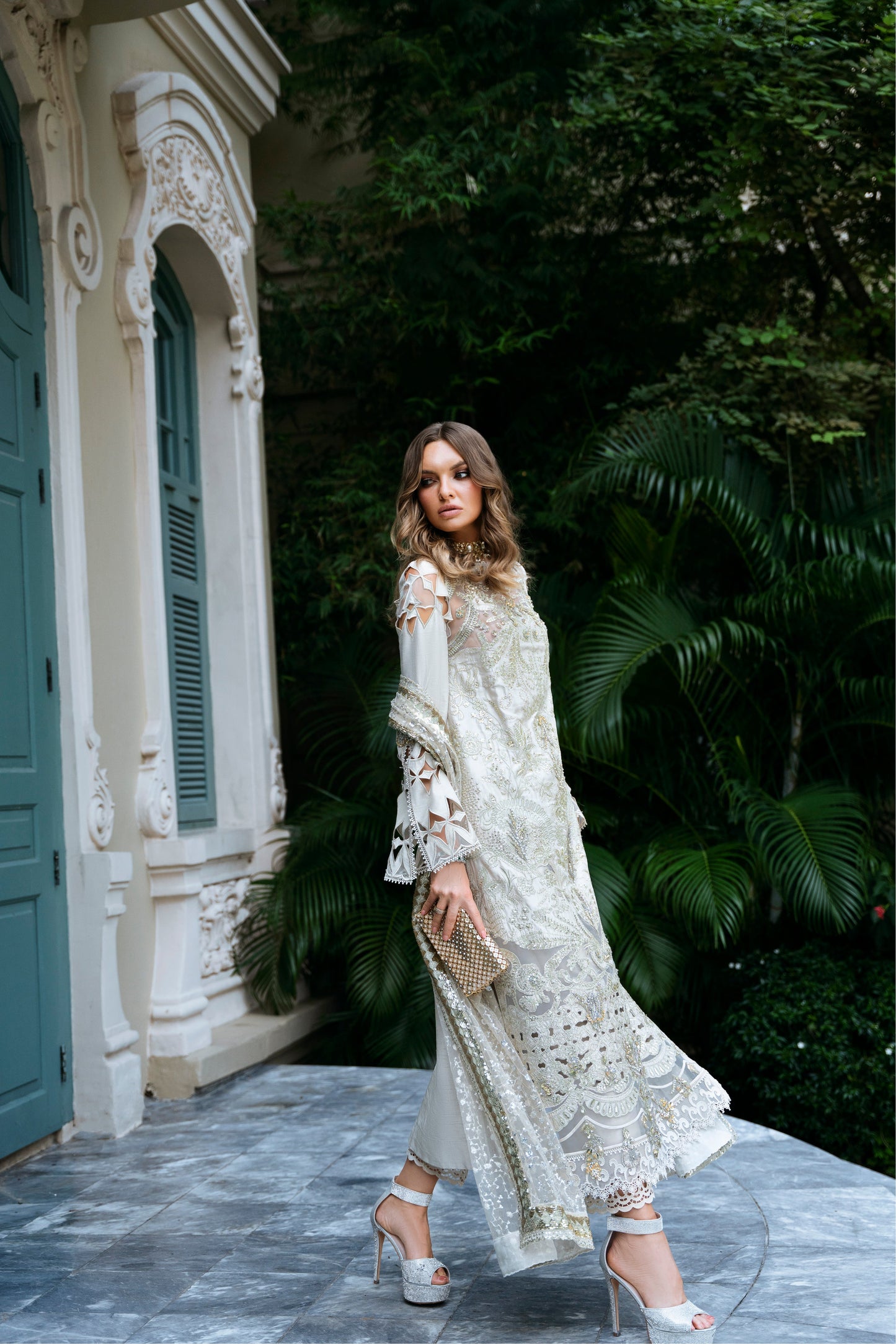 Model wearing Helena dress from Mysie by Tahira in a soft gold color, perfect for Pakistani luxury pret and online shopping in the UK.