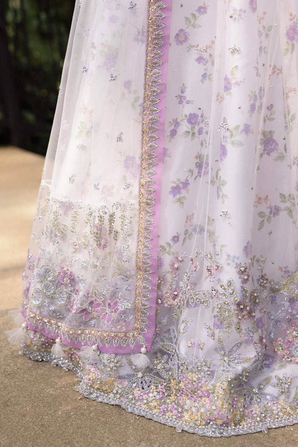 Model wearing Saira Rizwan ELINA-SRF25-05 in white and lilac floral embroidery – Pakistani luxury pret, shop online in UK.