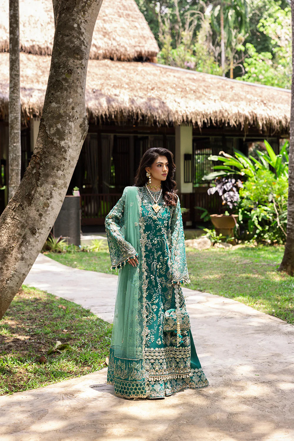 Model wearing Saira Rizwan KIANA-SRF25-04 in emerald green with silver embellishments – Pakistani luxury pret, shop online in UK.
