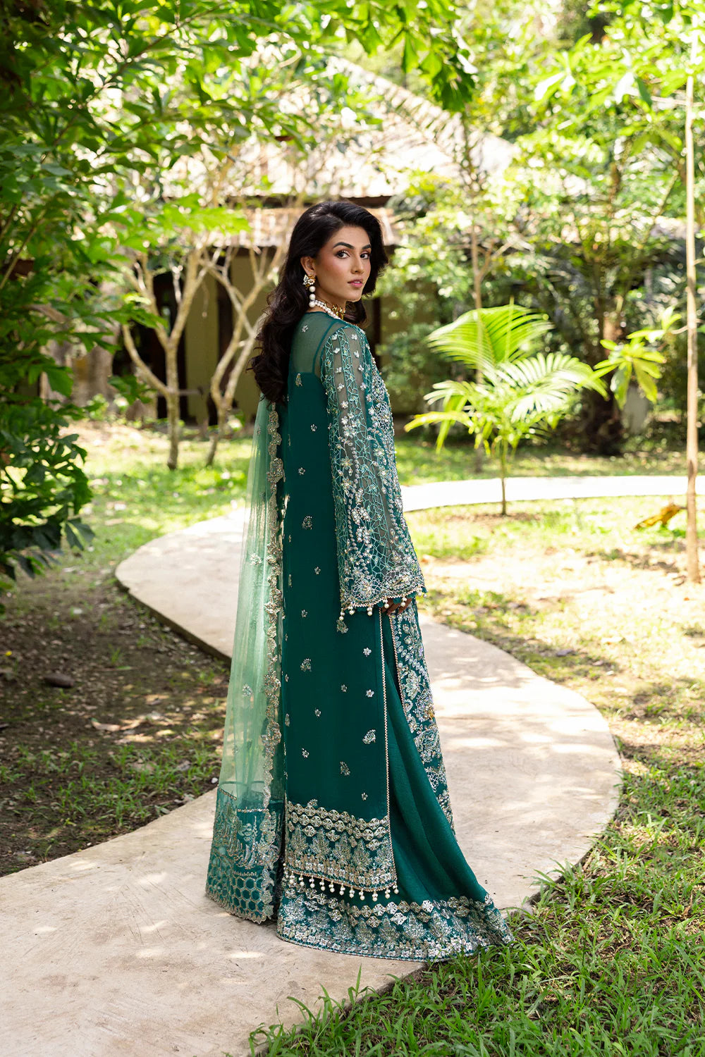Model wearing Saira Rizwan KIANA-SRF25-04 in emerald green with silver embellishments – Pakistani luxury pret, shop online in UK.
