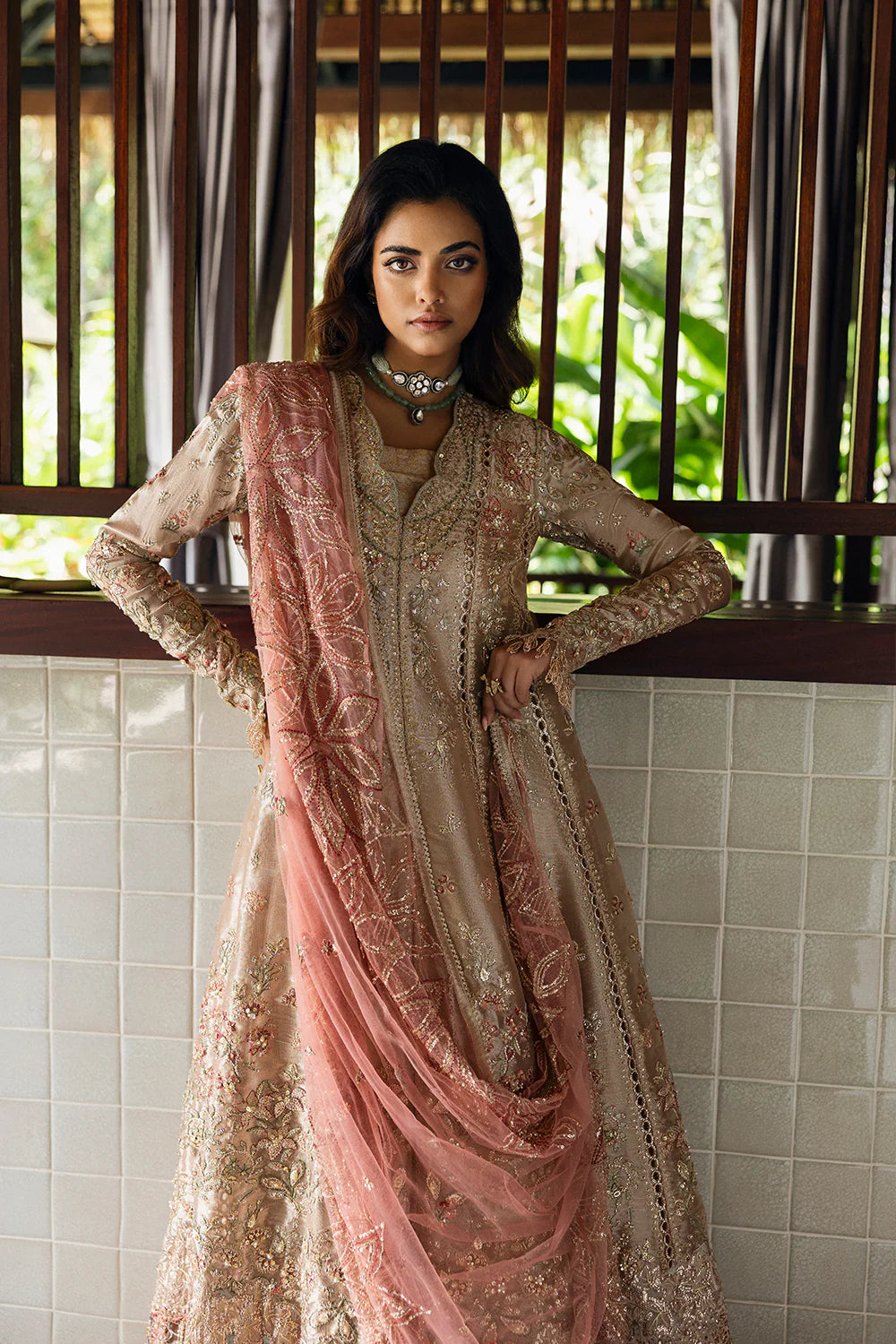 Model wearing Saira Rizwan ROHANA-SRF25-03 in champagne gold with pastel embroidery – Pakistani luxury pret, shop online in UK.