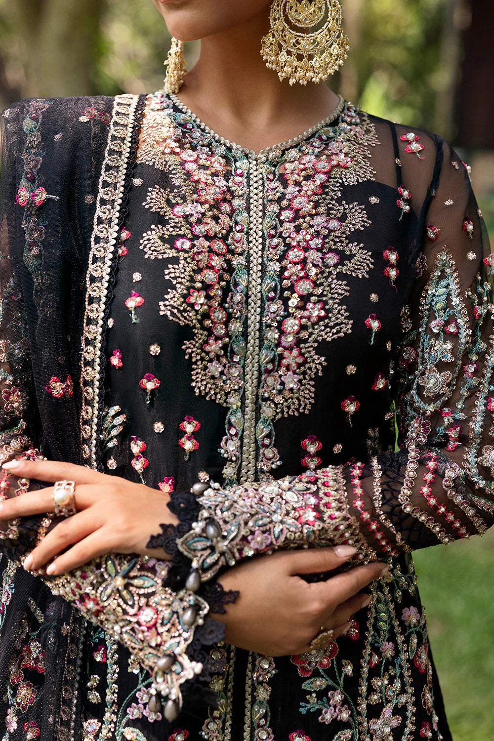Model wearing Saira Rizwan AVINA-SRF25-02 in black with pastel floral embroidery – Pakistani luxury pret, shop online in UK.