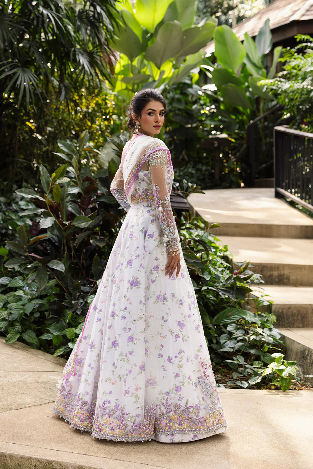 Model wearing Saira Rizwan ELINA-SRF25-05 in white and lilac floral embroidery – Pakistani luxury pret, shop online in UK.