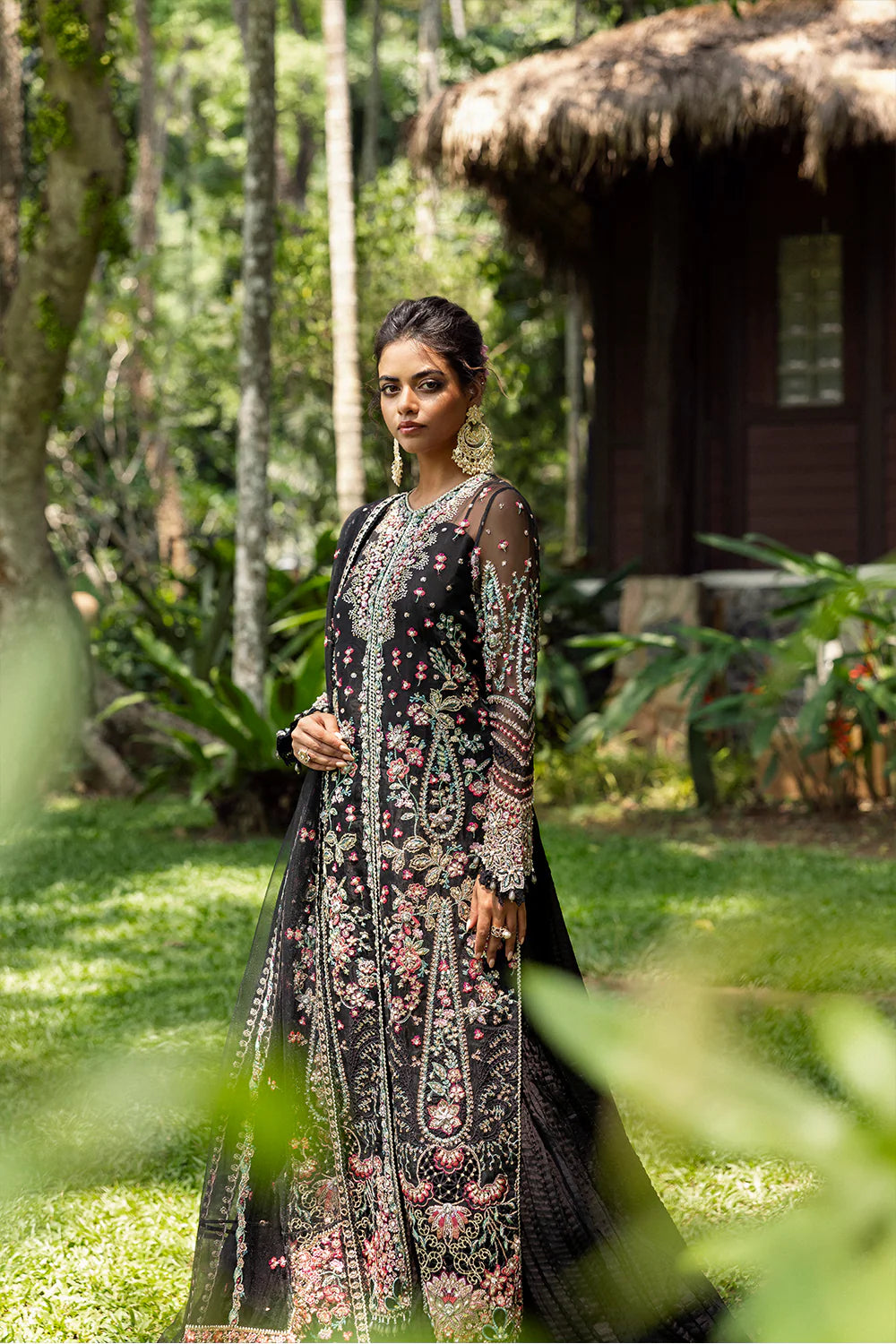 Model wearing Saira Rizwan AVINA-SRF25-02 in black with pastel floral embroidery – Pakistani luxury pret, shop online in UK.