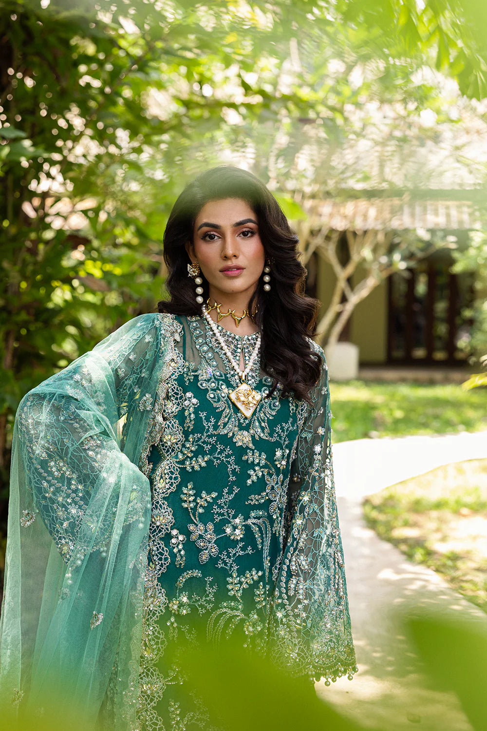 Model wearing Saira Rizwan KIANA-SRF25-04 in emerald green with silver embellishments – Pakistani luxury pret, shop online in UK.