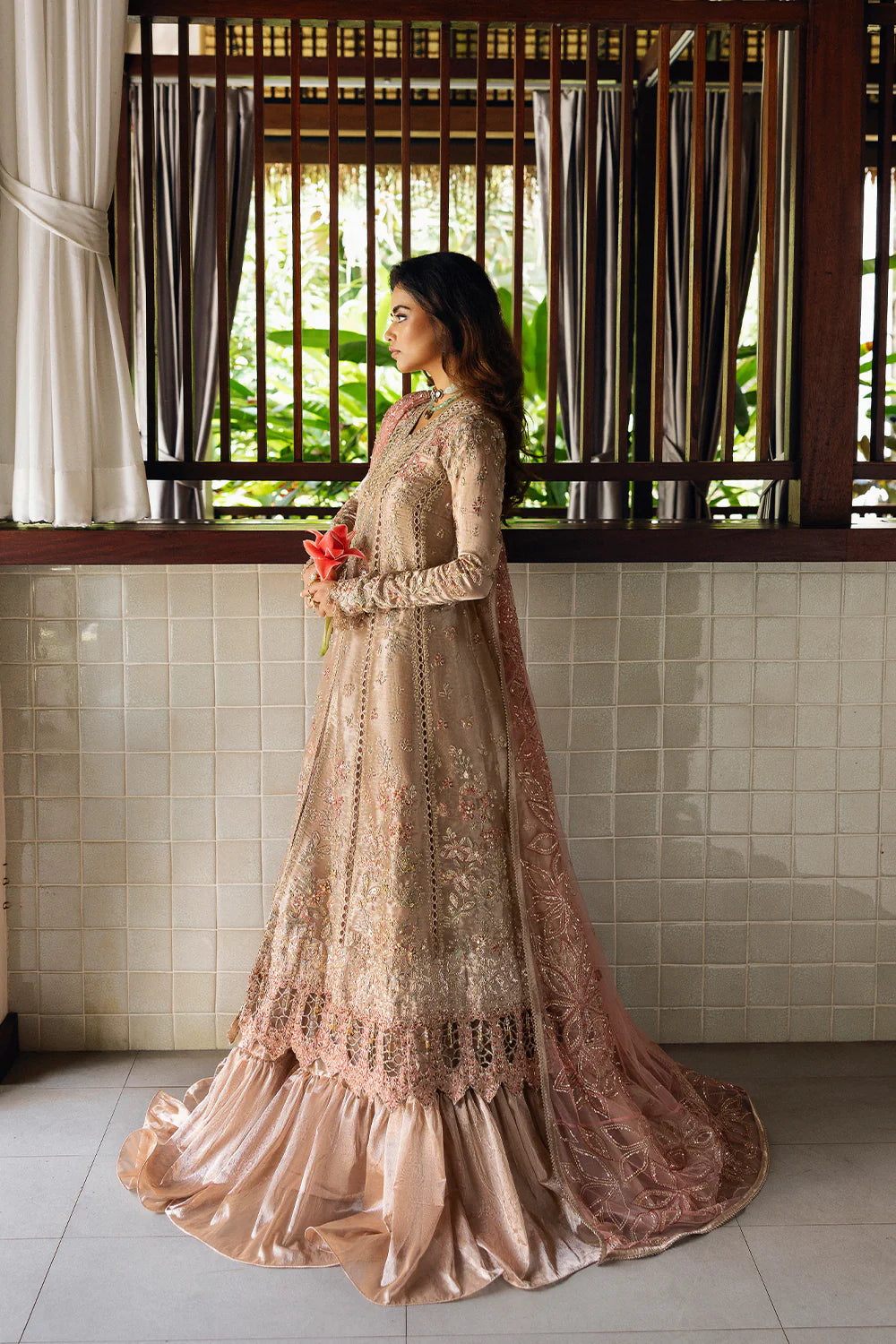 Model wearing Saira Rizwan ROHANA-SRF25-03 in champagne gold with pastel embroidery – Pakistani luxury pret, shop online in UK.
