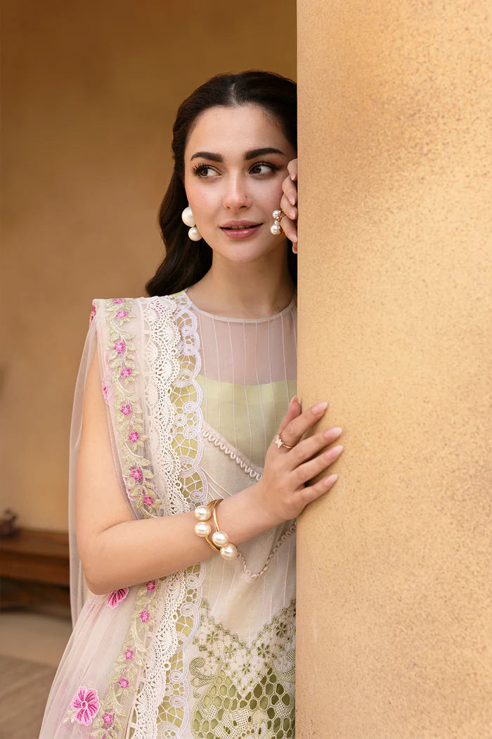 Model wearing pastel green and ivory embroidered long frock with floral dupatta from Saira Rizwan, Pakistani luxury pret, Pakistani clothes online in UK.