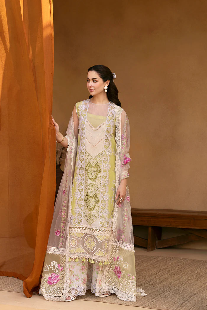 Model wearing pastel green and ivory embroidered long frock with floral dupatta from Saira Rizwan, Pakistani luxury pret, Pakistani clothes online in UK.