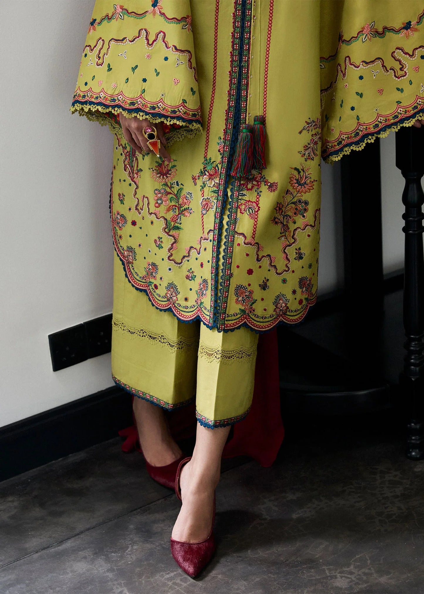 Model wearing apple green Alva outfit with red detailing from Hussain Rehar Pret SS '25, Pakistani luxury pret and clothes online in UK.