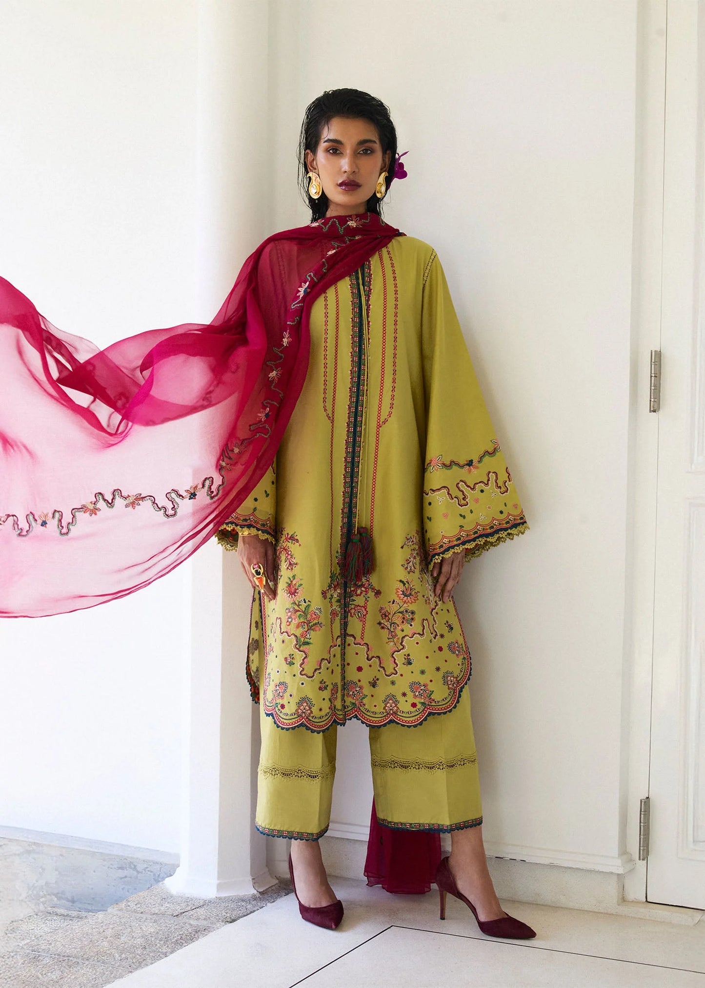 Model wearing apple green Alva outfit with red detailing from Hussain Rehar Pret SS '25, Pakistani luxury pret and clothes online in UK.