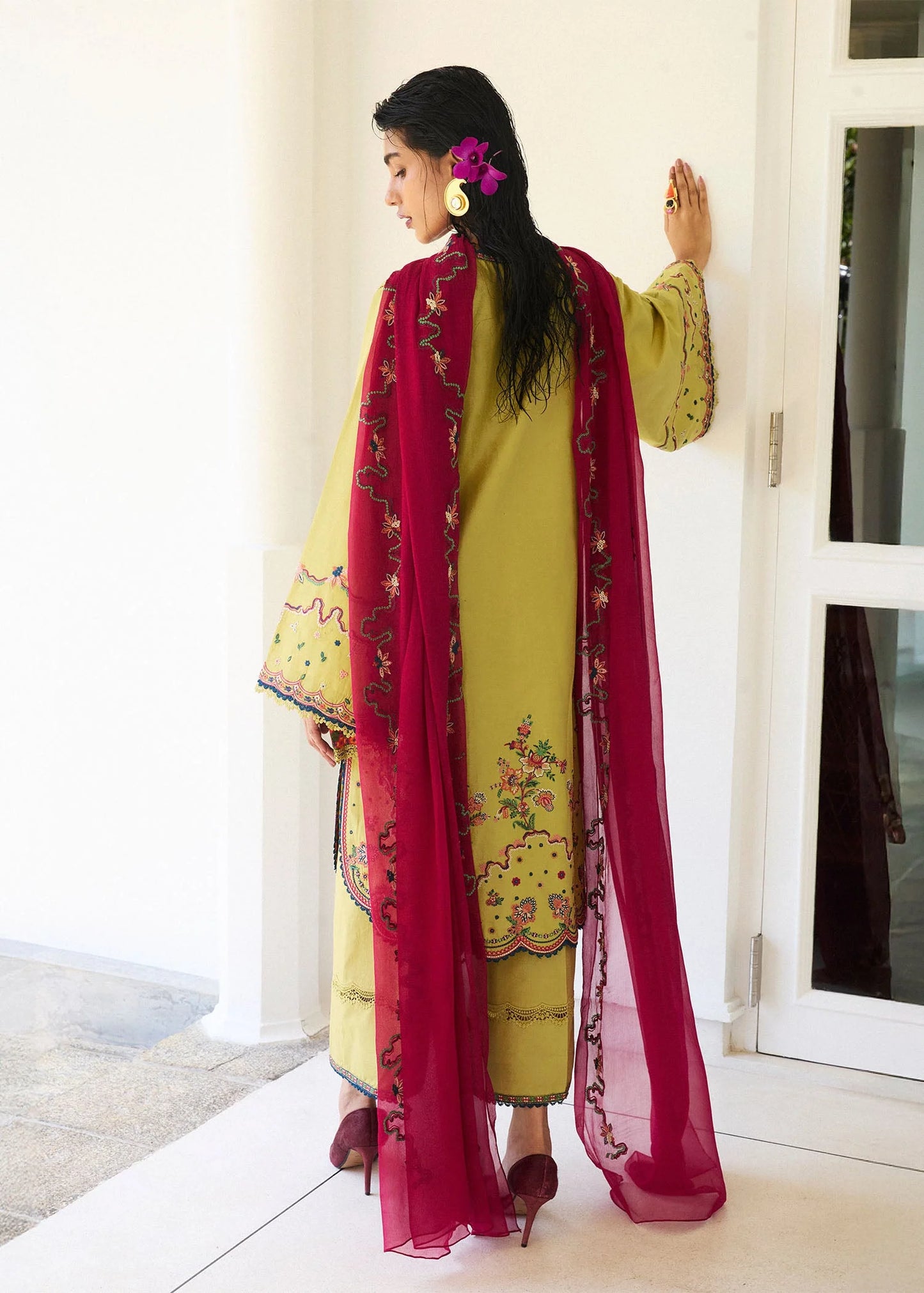 Model wearing apple green Alva outfit with red detailing from Hussain Rehar Pret SS '25, Pakistani luxury pret and clothes online in UK.