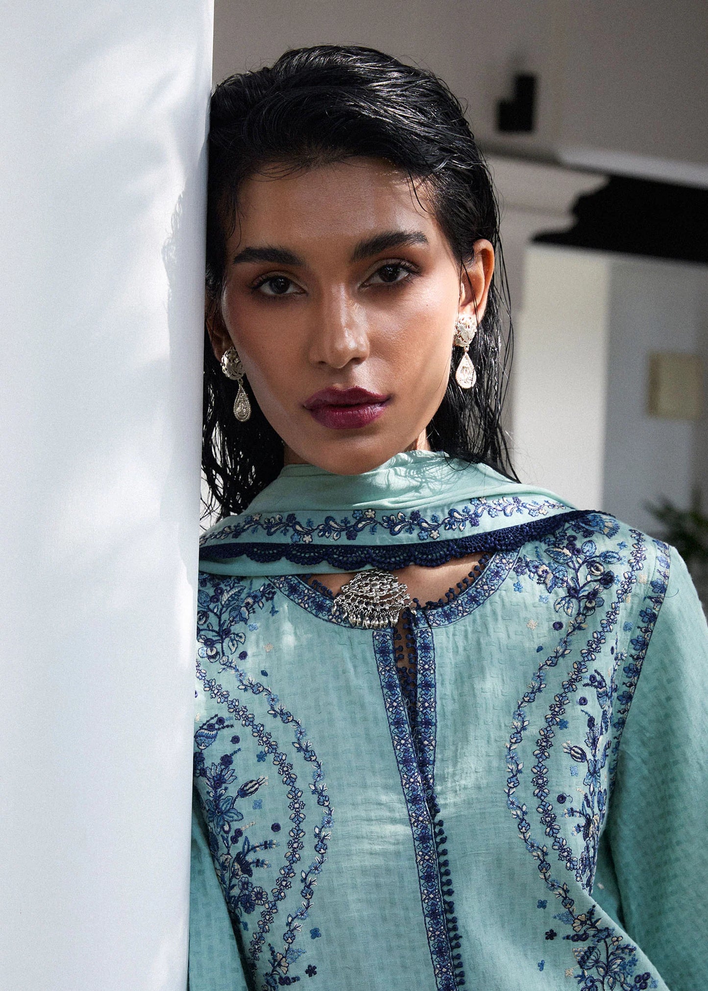 Model wearing light turquoise and navy embroidered Nesta outfit from Hussain Rehar Pret SS '25, Pakistani luxury pret and clothes online in UK.