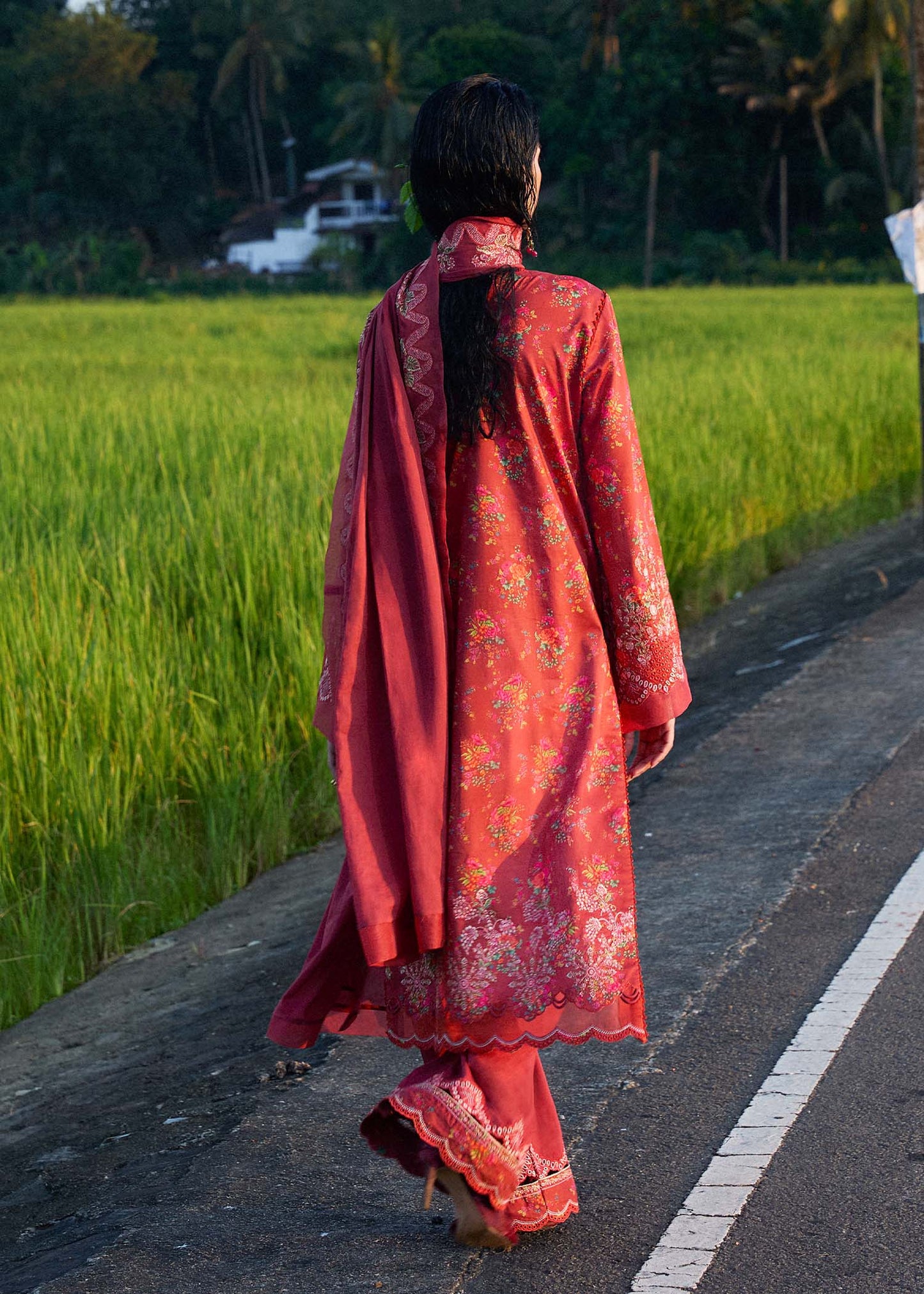 Model wearing deep coral red Nahla dress from Hussain Rehar Pret SS '25, highlighting Pakistani luxury pret and Pakistani clothes online in UK.