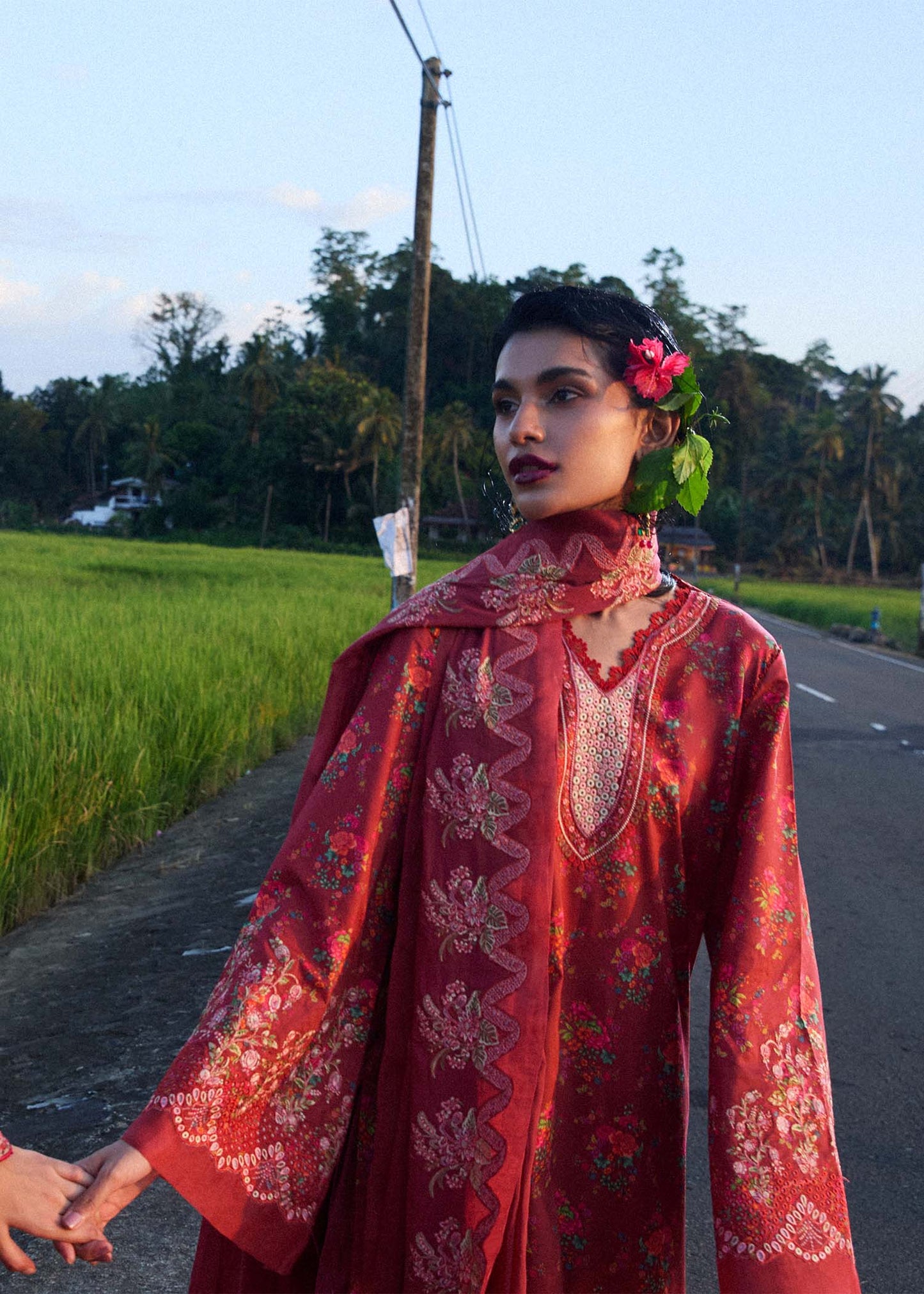 Model wearing deep coral red Nahla dress from Hussain Rehar Pret SS '25, highlighting Pakistani luxury pret and Pakistani clothes online in UK.