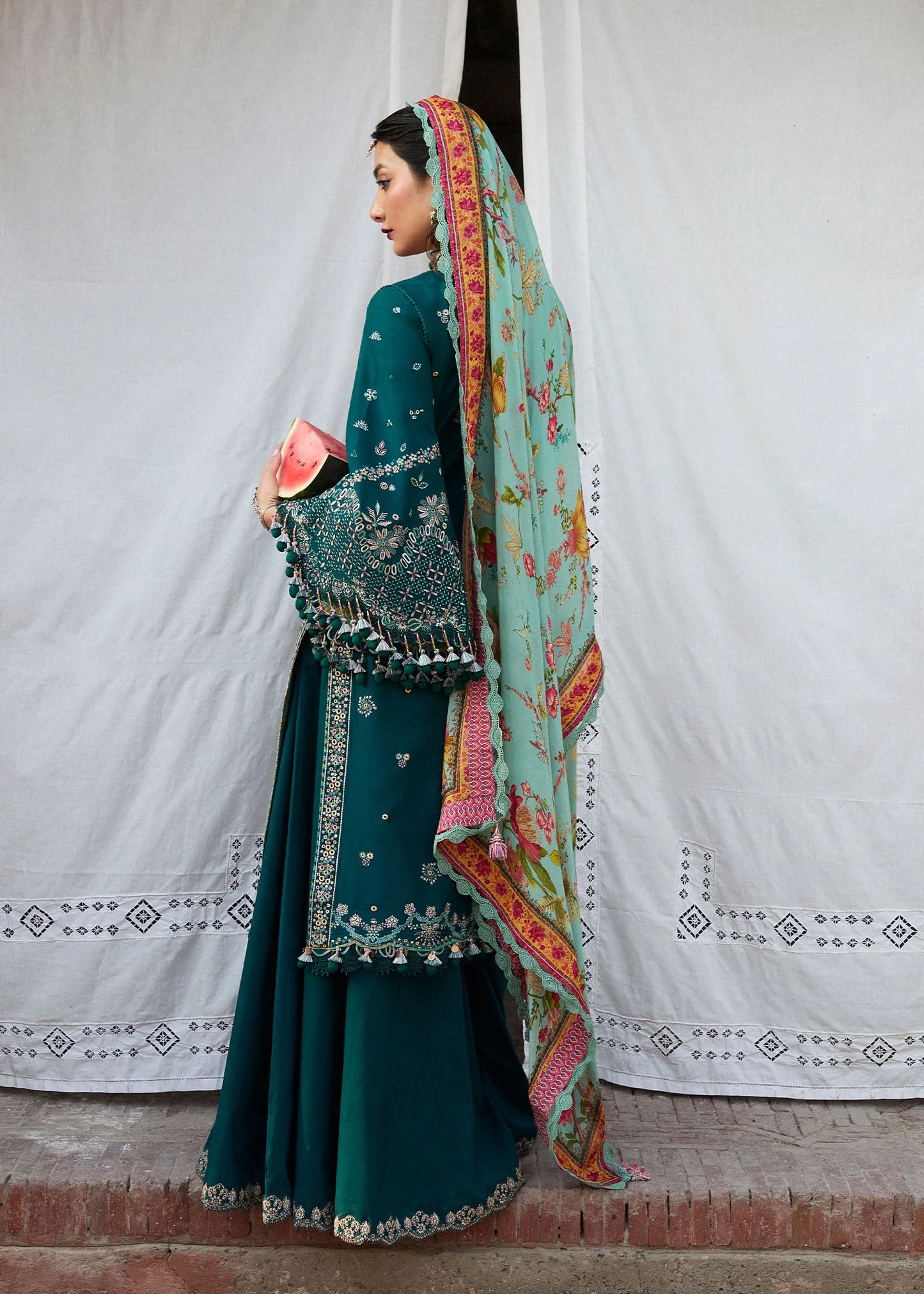 Model wearing teal and pastel floral Saher from Hussain Rehar Nirmal SS '25, Pakistani luxury pret and Pakistani clothes online in UK.
