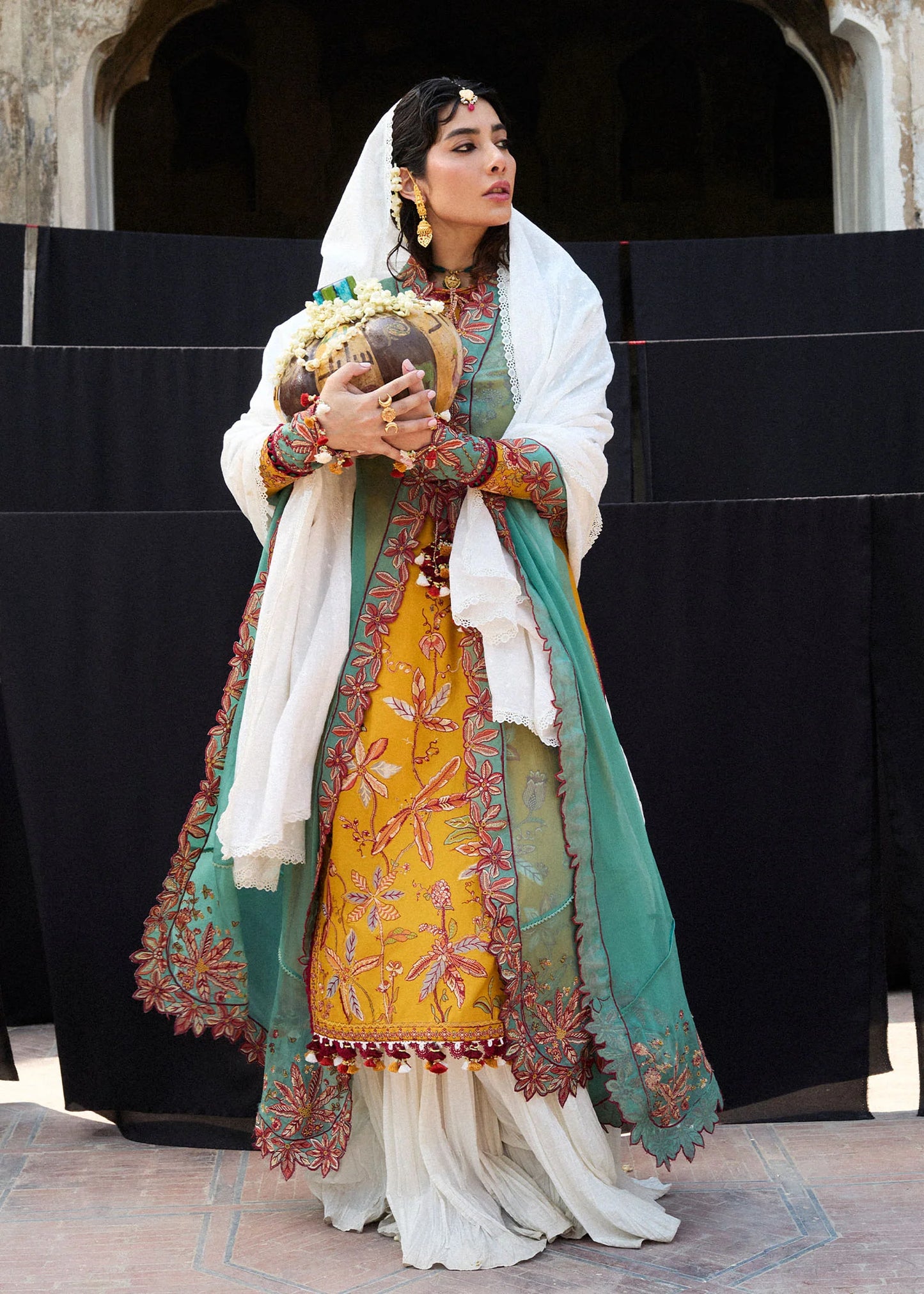 Model wearing mustard and teal Masam from Hussain Rehar Nirmal SS '25, Pakistani luxury pret and Pakistani clothes online in UK.