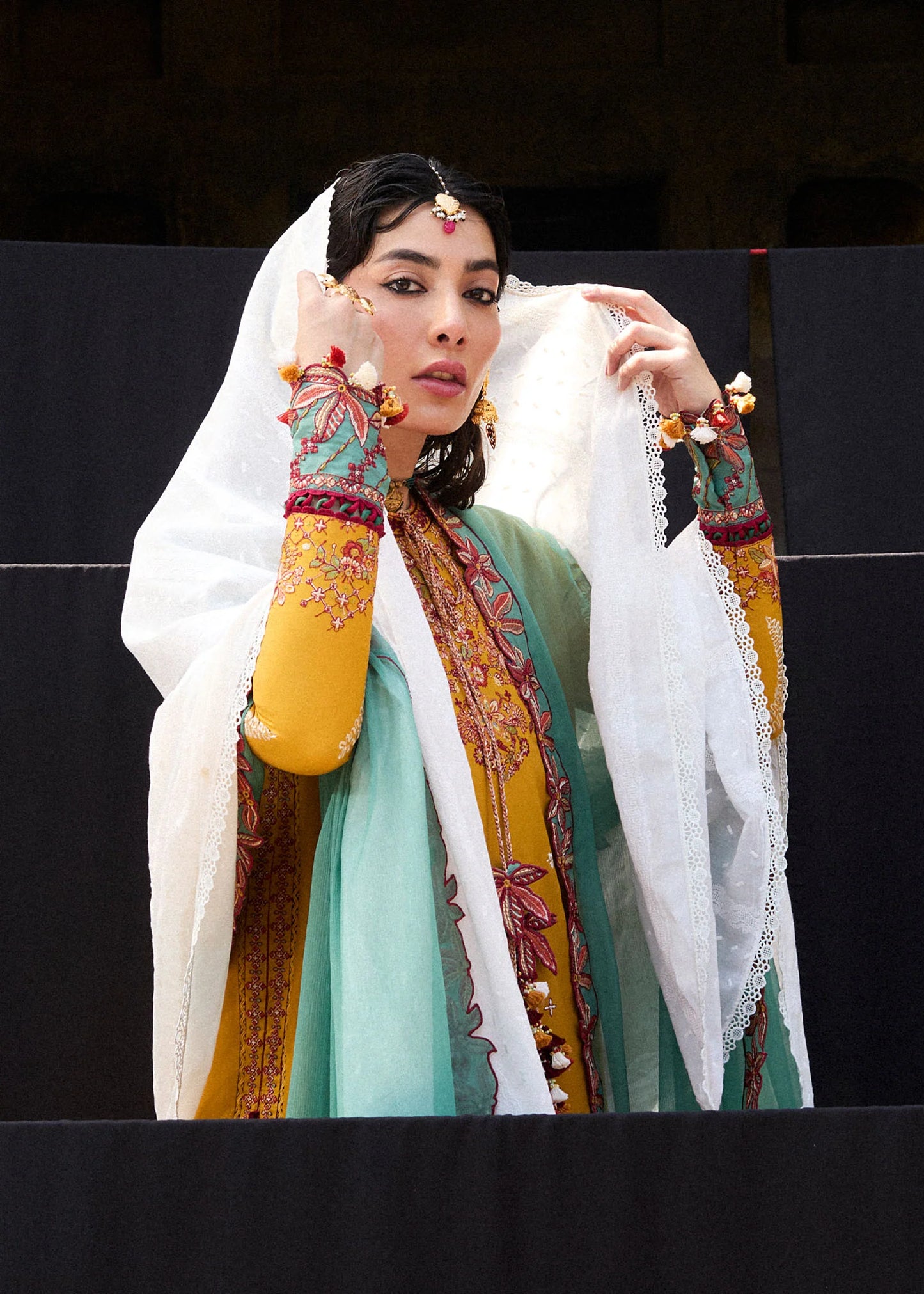 Model wearing mustard and teal Masam from Hussain Rehar Nirmal SS '25, Pakistani luxury pret and Pakistani clothes online in UK.