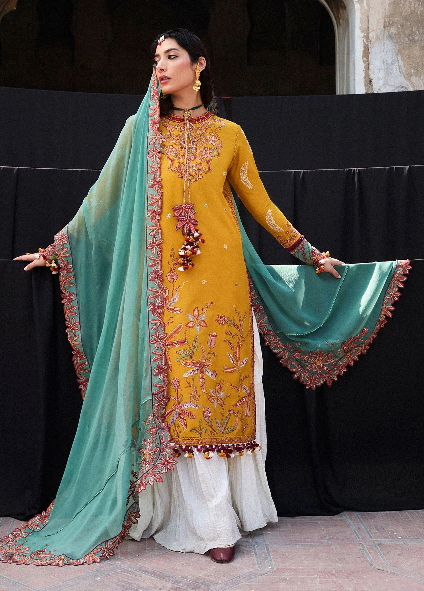 Model wearing mustard and teal Masam from Hussain Rehar Nirmal SS '25, Pakistani luxury pret and Pakistani clothes online in UK.